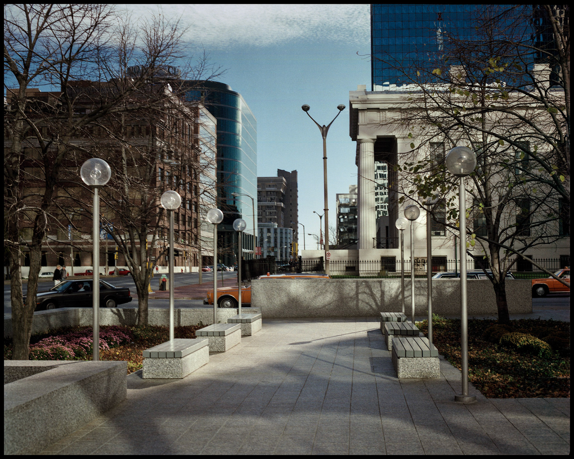 Park benches across from the Old Courthouse at the corner of 4th and Chestnut in downtown St. Louis, Missouri 1988. Part of a series shot one warm afternoon in November, 1988 called An Afternoon in St. Louis (a subset of my Industrial Geometry series).