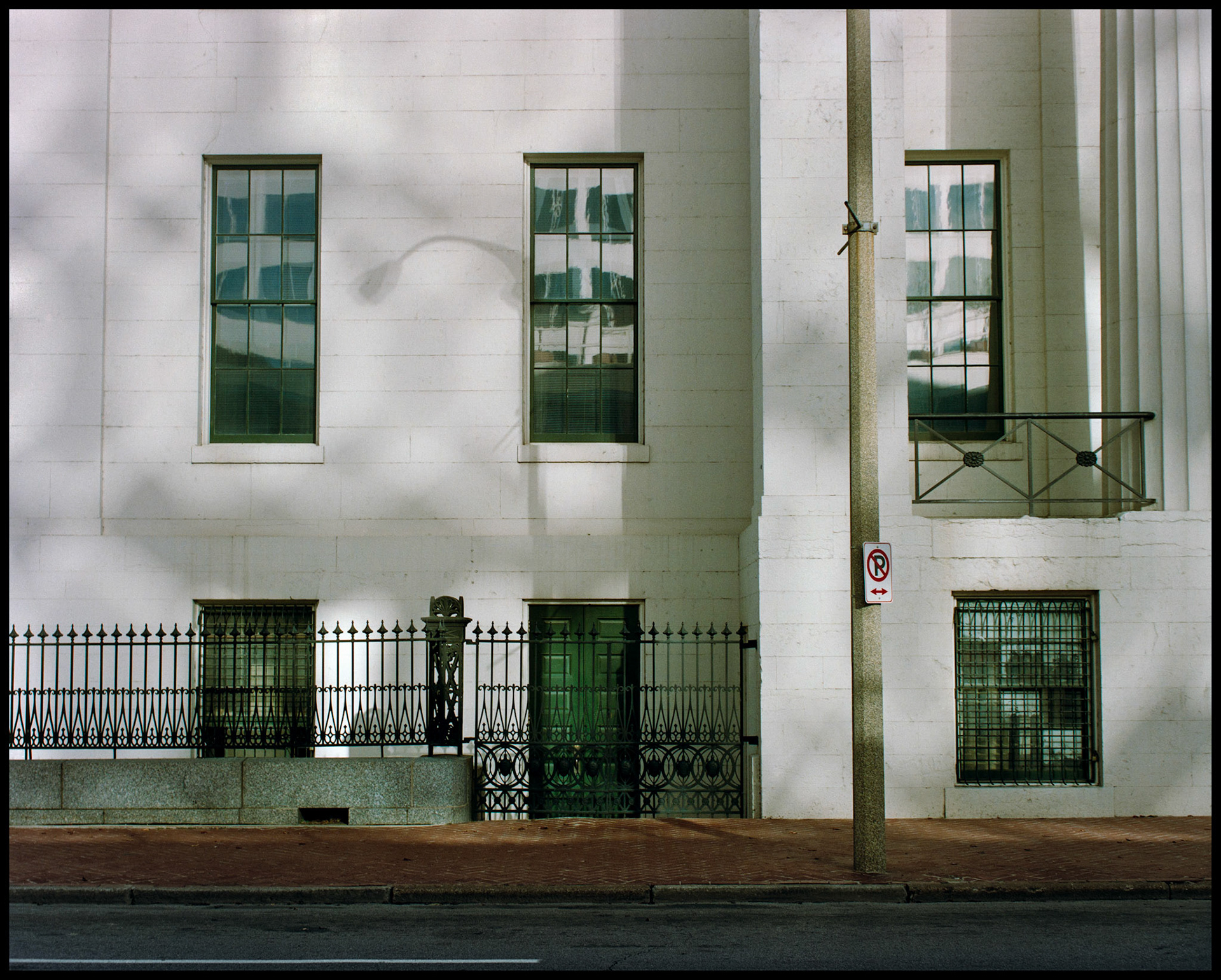 A minimal abstract detail of the mottled shadows and window reflections from a wall of the Old Courthouse in downtown St. Louis, Missouri 1988. Part of a series shot one afternoon in November, 1988 called An Afternoon in St. Louis (a subset of my Industrial Geometry series).