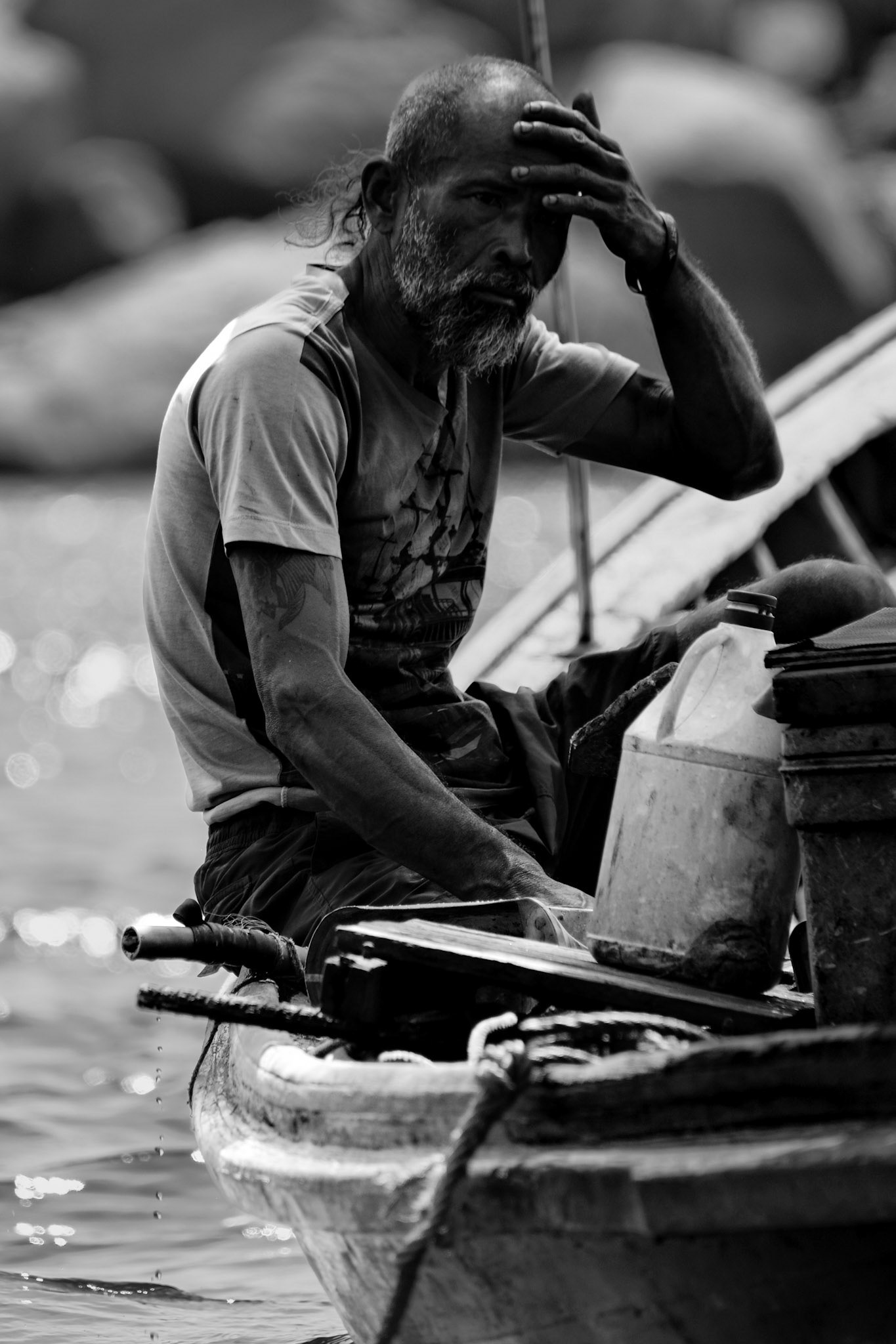 A fisherman works on his boat – Nangyuan Island Beach, Ko Tao, Thailand
