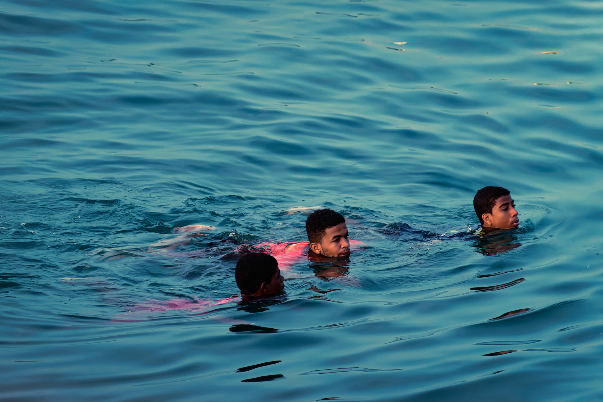 Young men jump off the pier – Stone Town, Zanzibar, Tanzania