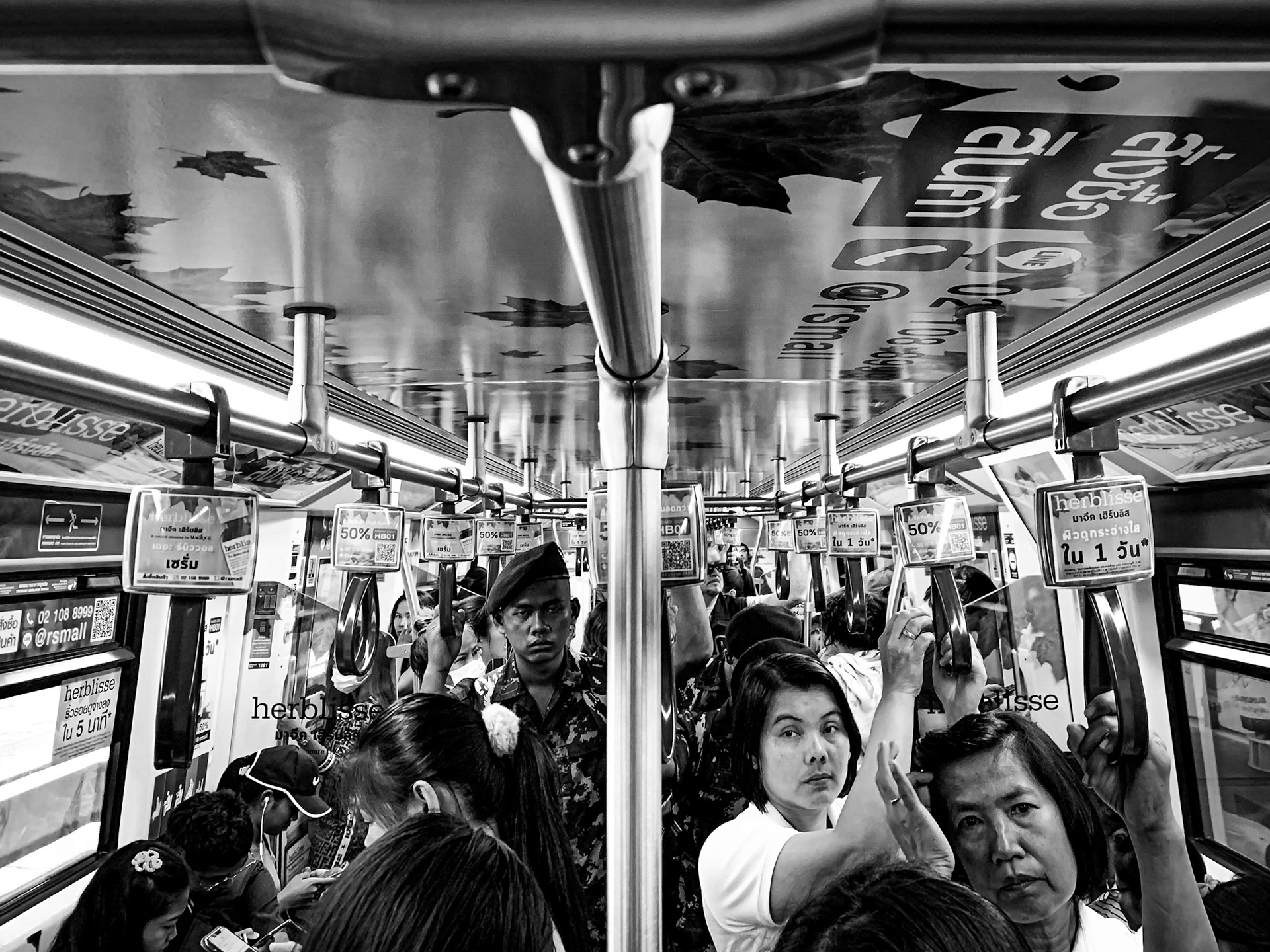 Commuters on the Sky BTS Train – Bangkok, Thailand