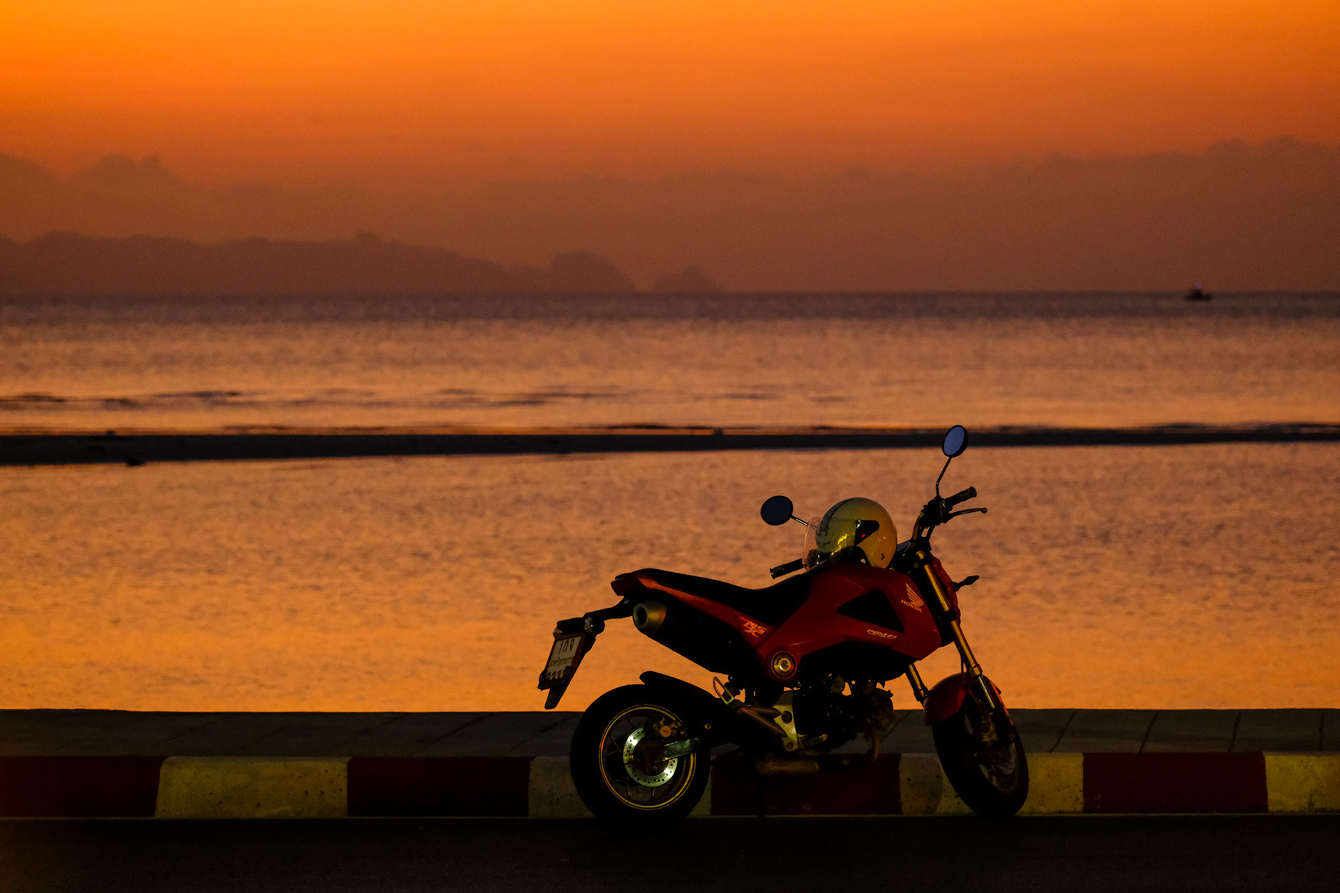 A parked motorbike at sunset – Koh Samui, Thailand