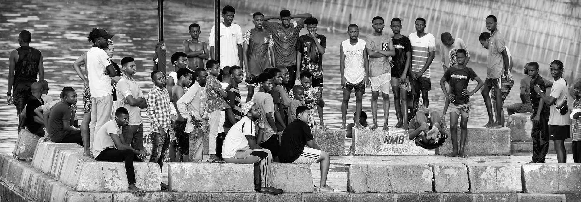 Young men jump off the pier – Stone Town, Zanzibar, Tanzania