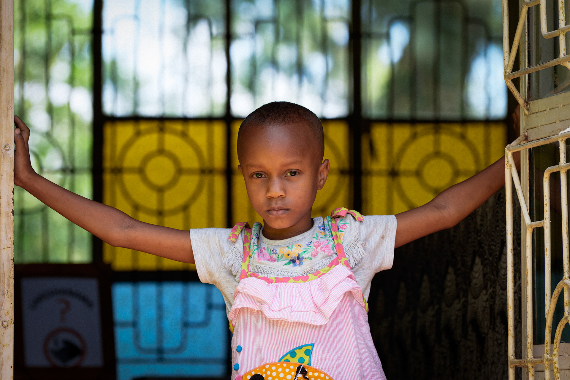 A young girl standing in the doorway of the library – Mwika Village, Kilimanjaro Region, Tanzania