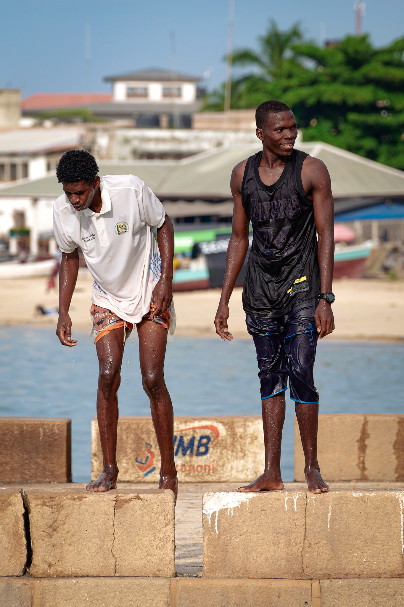 Young men jump off the pier – Stone Town, Zanzibar, Tanzania