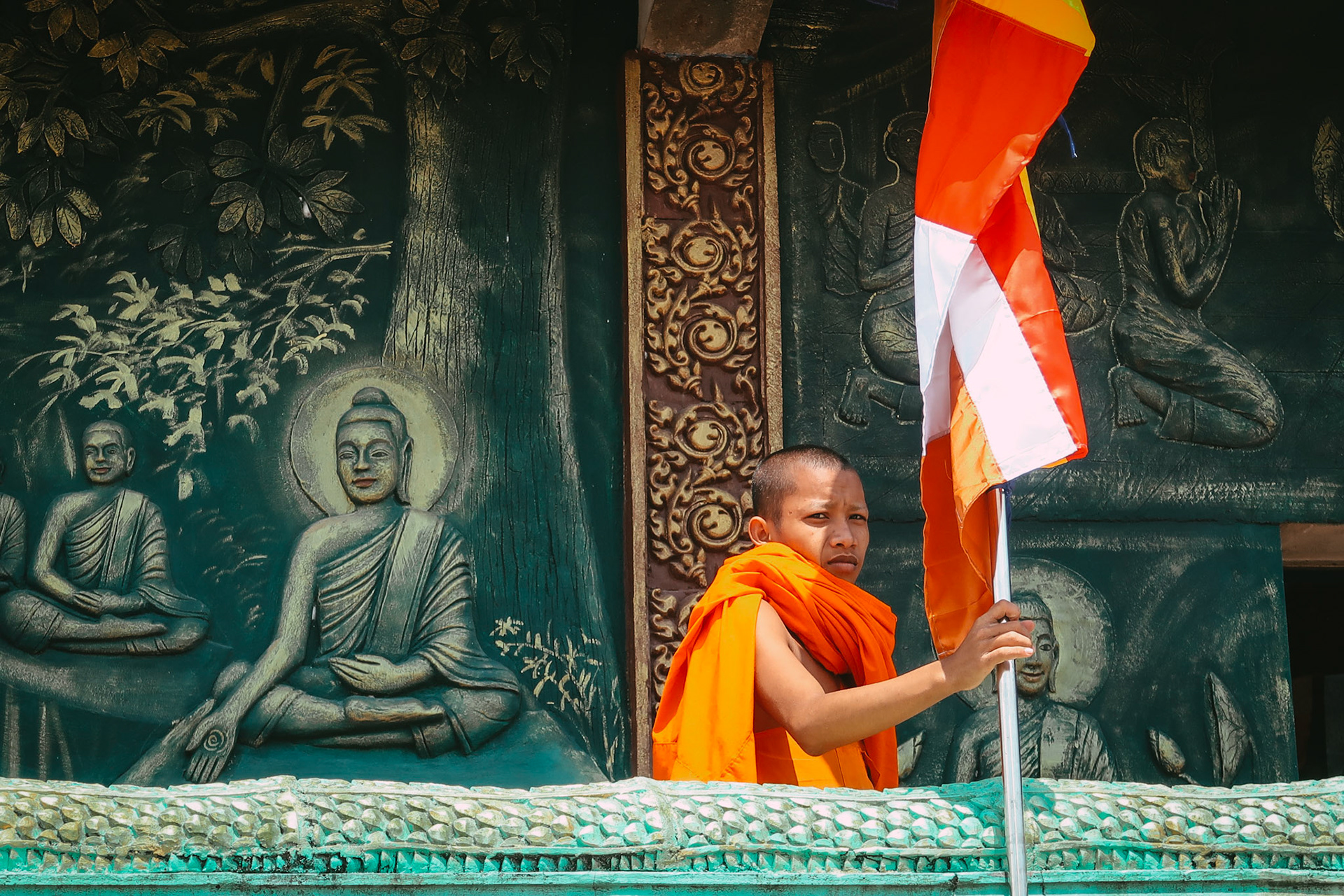 A monk holds a flag – Bokor National Park, Kampot, Cambodia