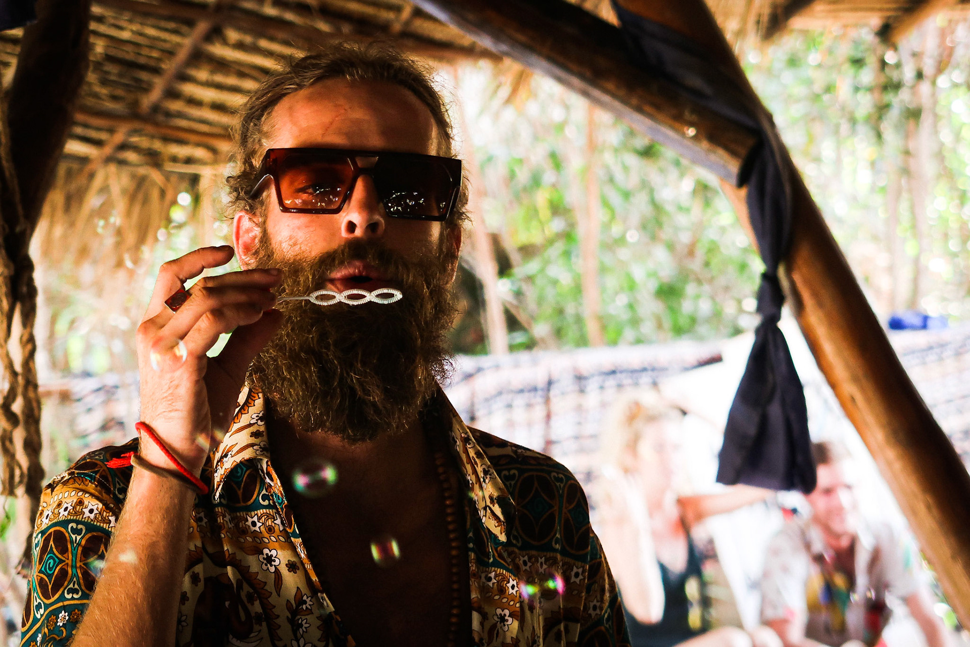 A DJ blows bubbles at a party – Otres Village, Sihanoukville, Cambodia