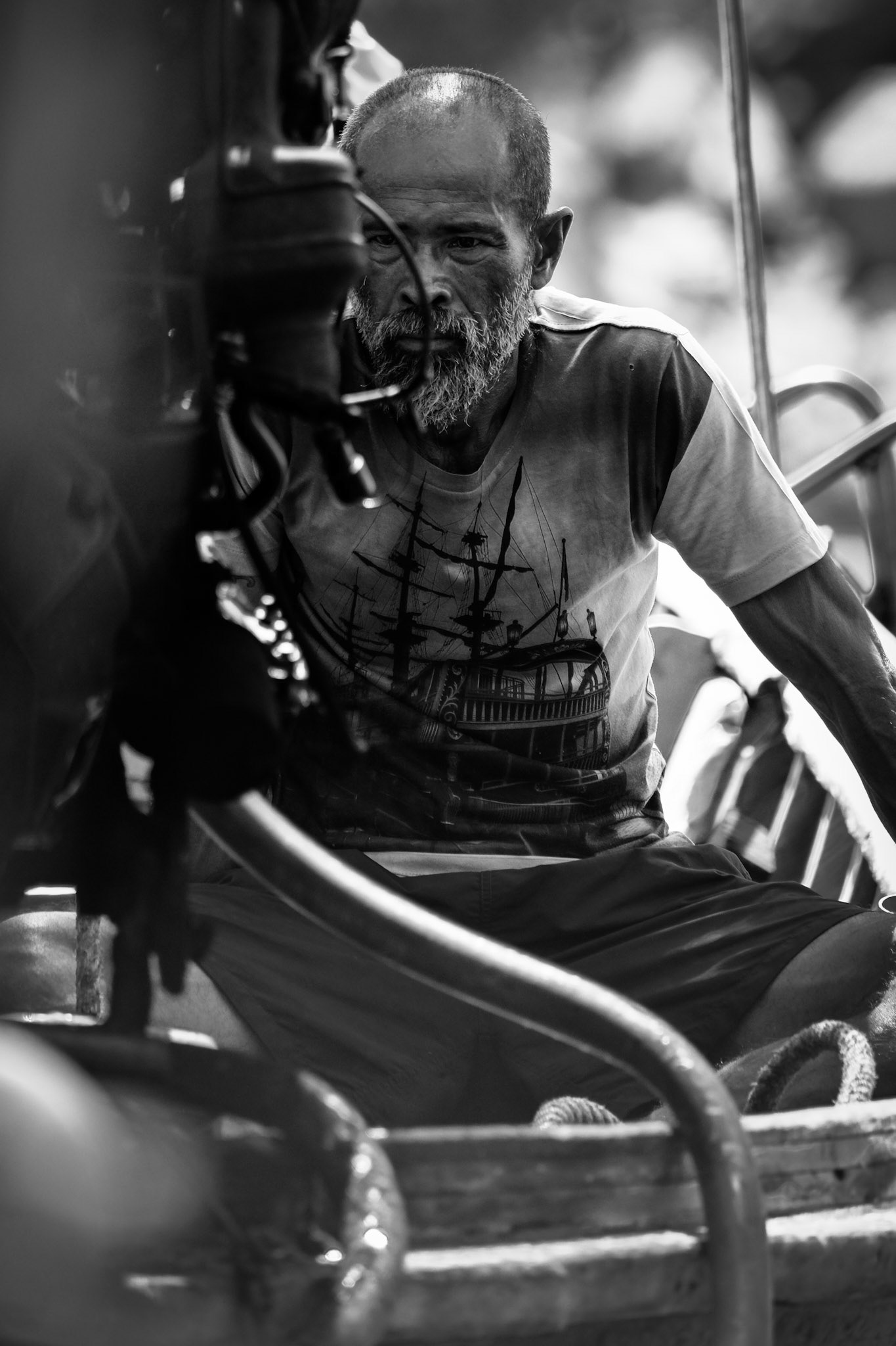 A fisherman works on his boat – Nangyuan Island Beach, Ko Tao, Thailand