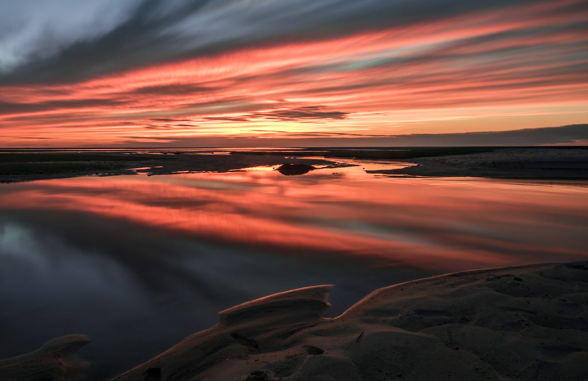 Bottom-lit clouds reflecting in teh water