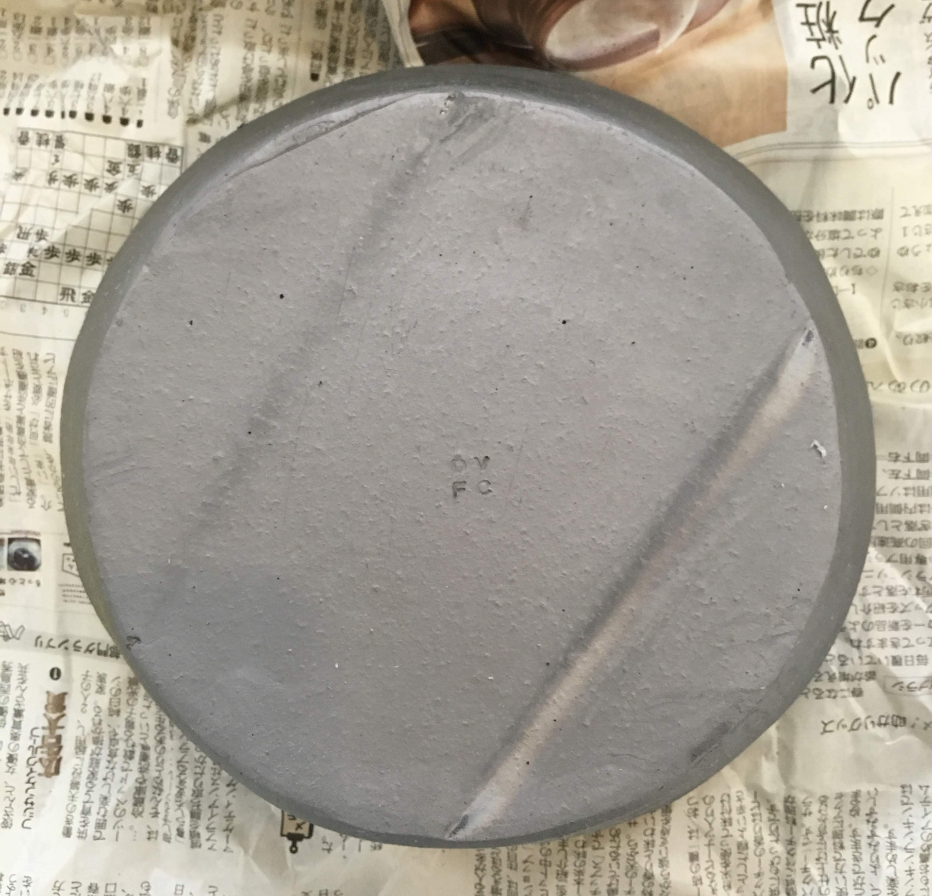 Bottom part of the pot after firing and smoking.