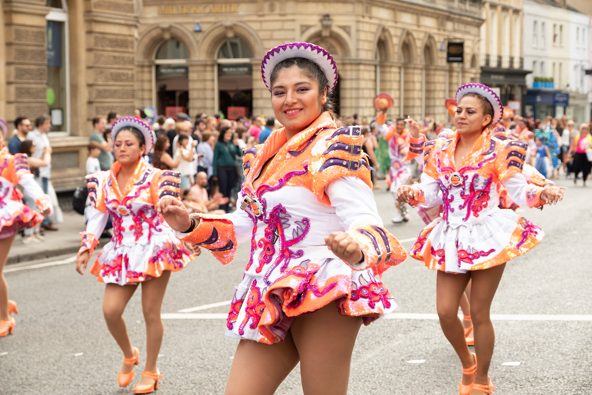 Pictured: Colourful costumes - Dancer peforms as part of the 2019 Bath City Carnival Parade, George Street, Bath, July 13th, 2019