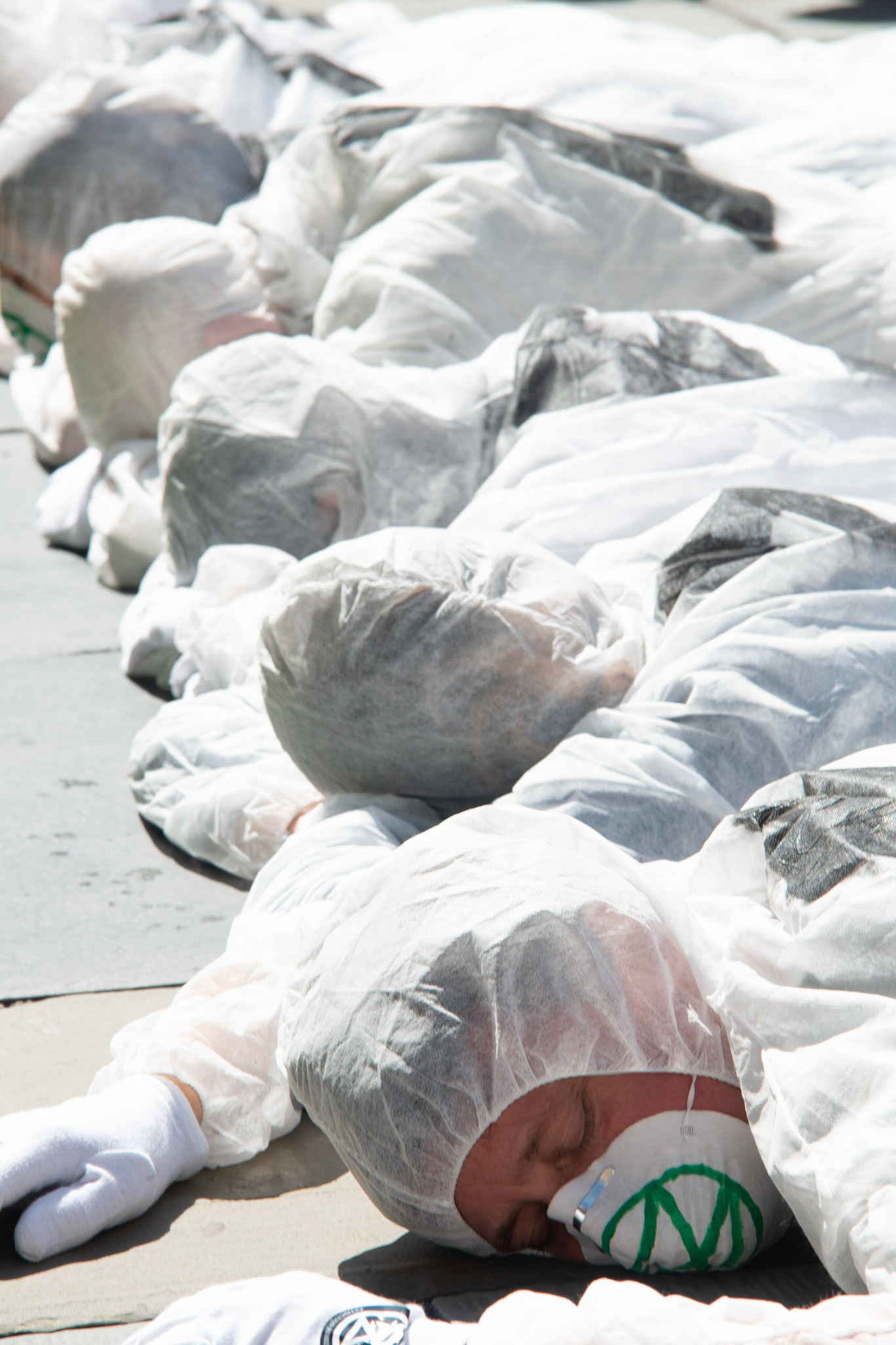 Extinction rebbelion - as part of the protest protestors dressed in 'Hazmat' suits inact death outside the Abbey, Bath 17/8/2019