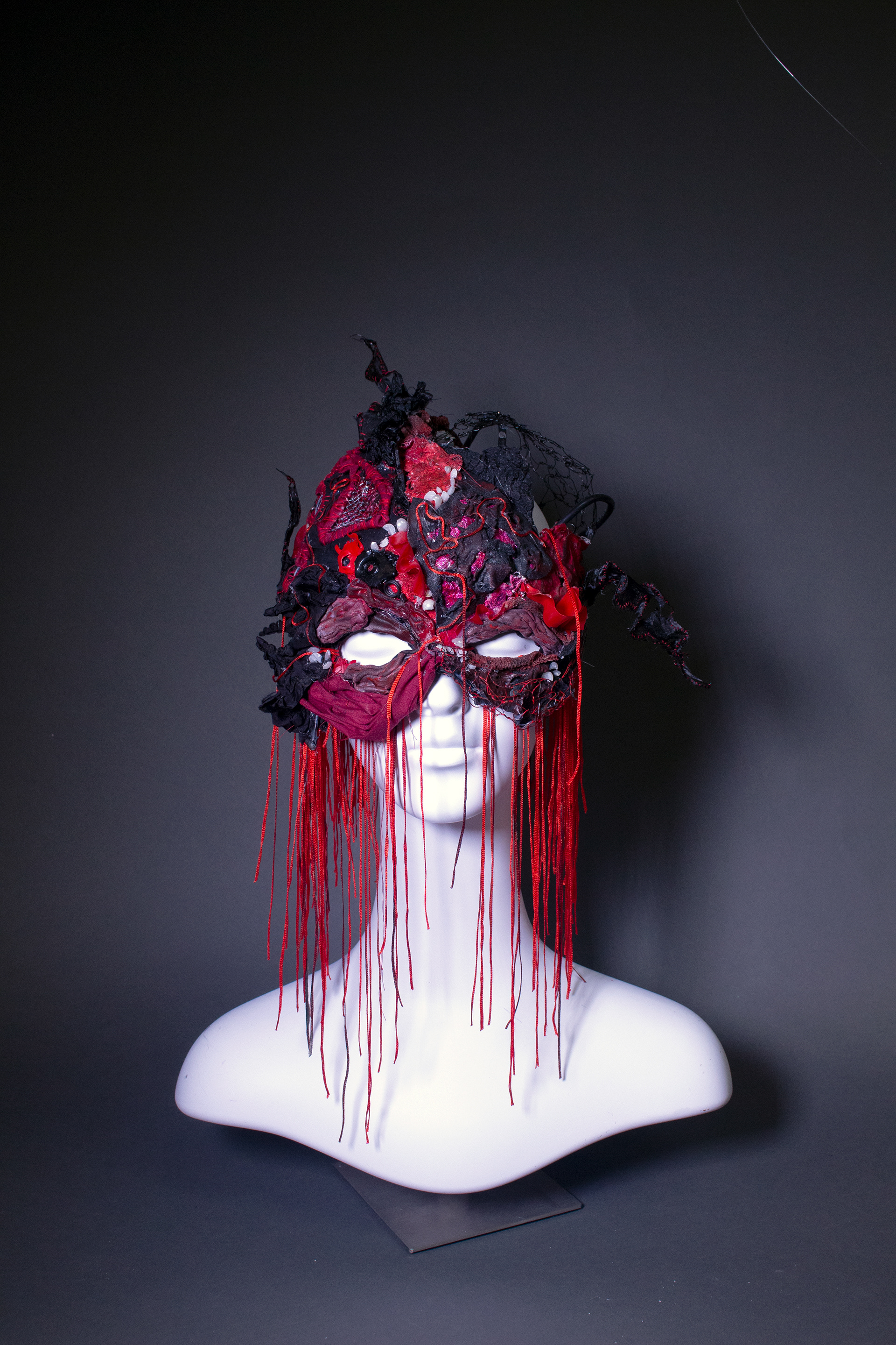 Fabric, worbla (thermoplastic), heat gun on fabric, foil, acrylic paint, wire, crushed beads, chinese string, mesh net, plaster, athletic bandage