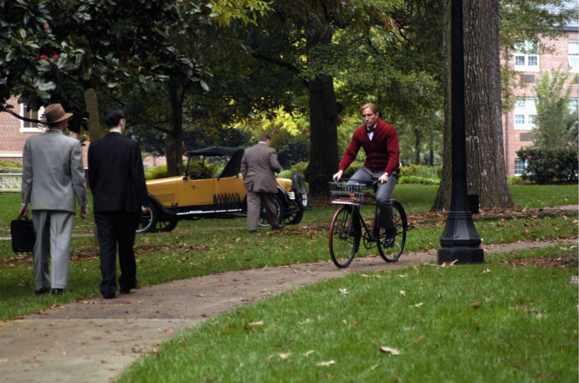 Caviezel rides across the quad at ASC