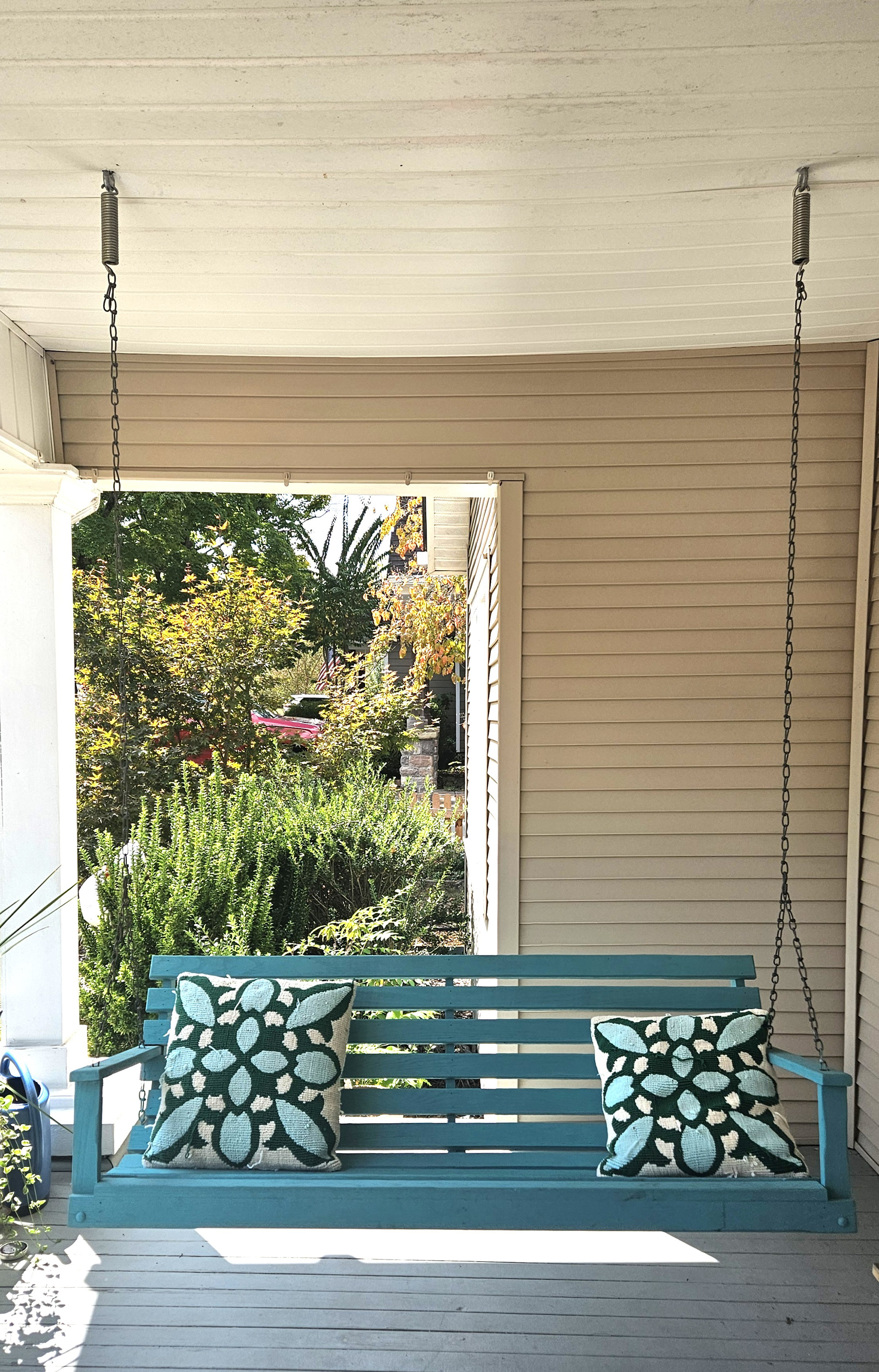 Porch swing rehang with forged through-bolts into a custom ceiling beam at a home in Red Bank, Chattanooga, TN