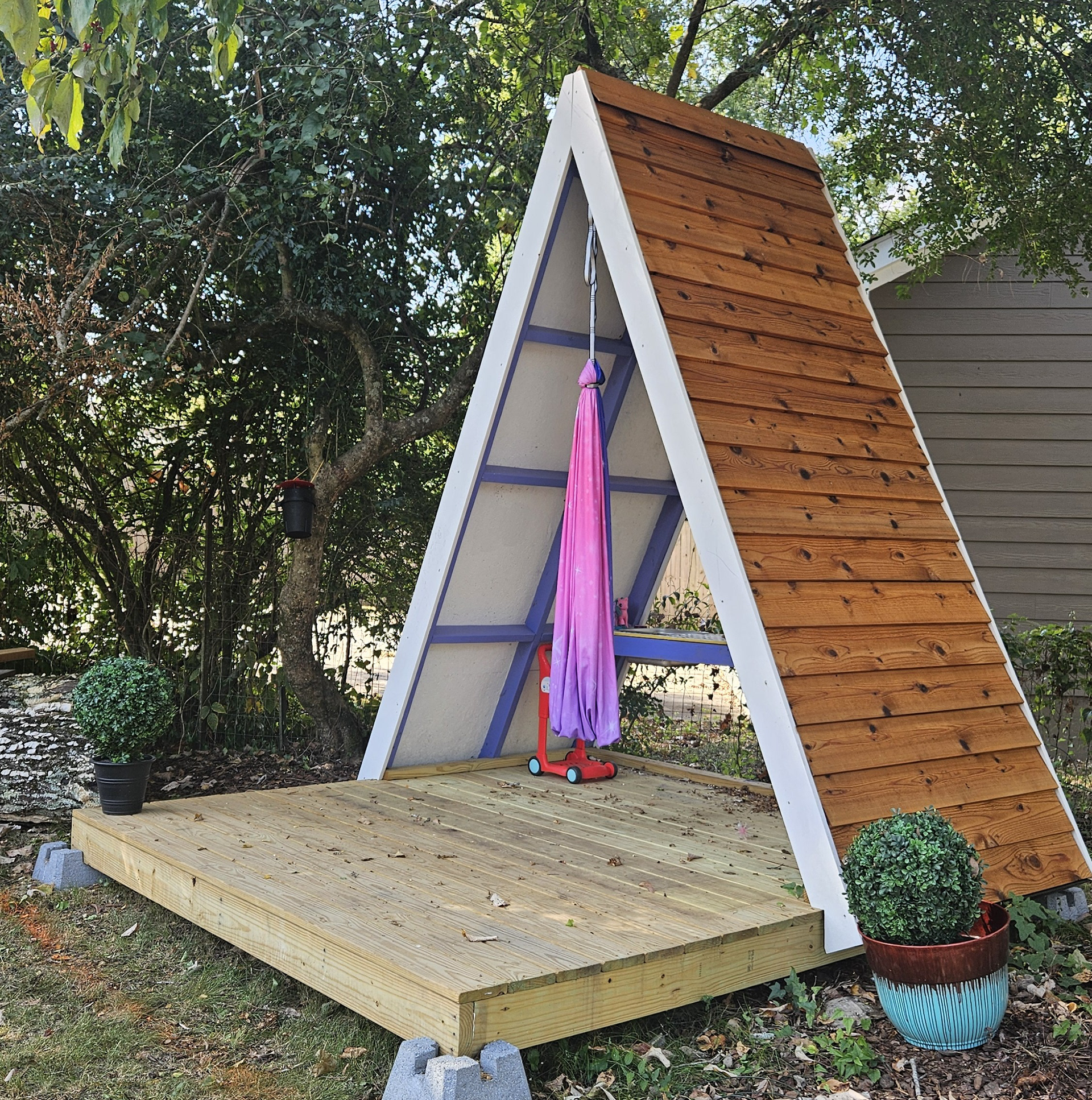 Custom combination a-frame playhouse, summer house and stage in a backyard in Red Bank, Chattanooga, TN