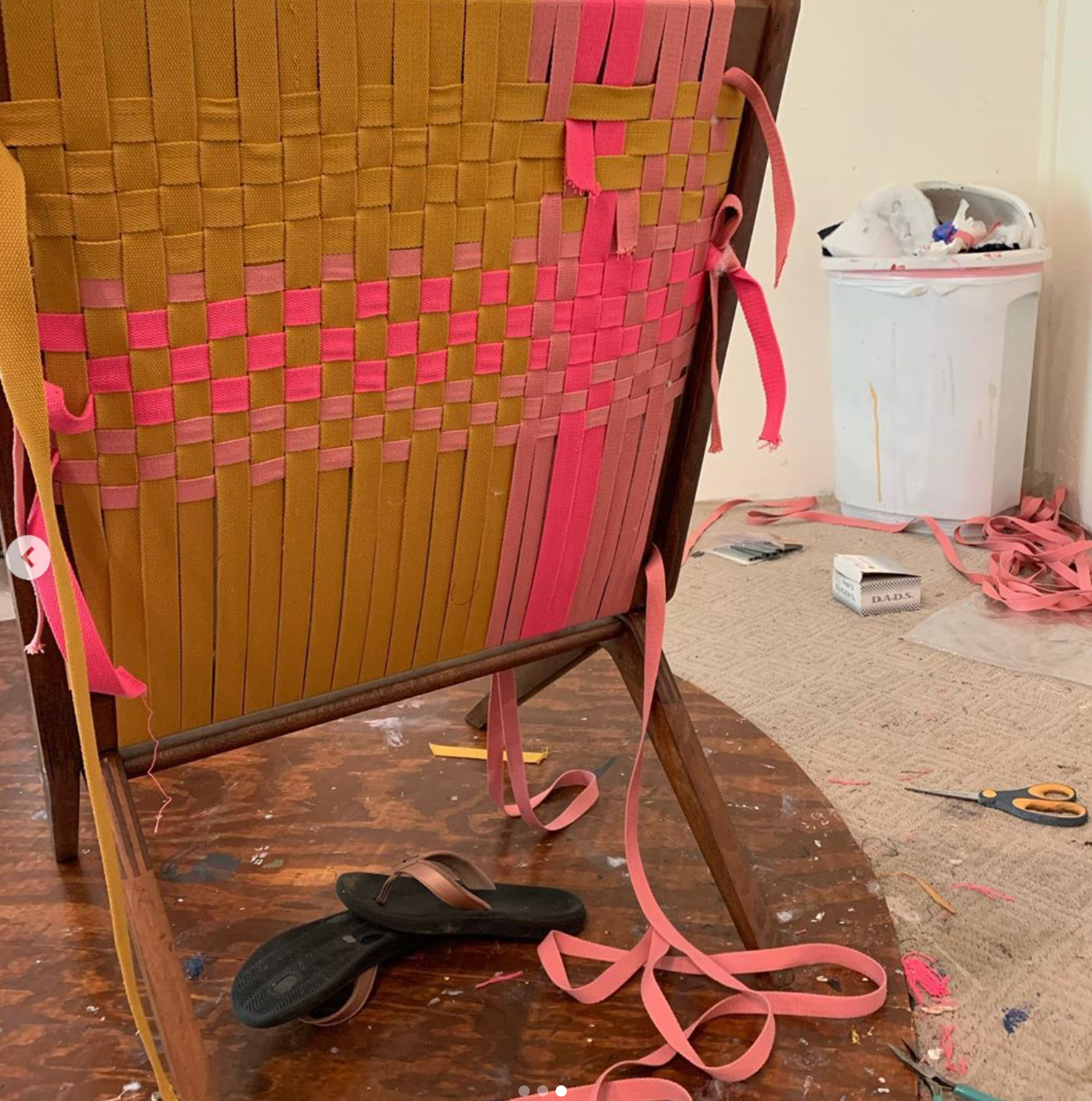 Beginning stages of the chair. I didn't order enough strapping, and had to put the project on hold for a month. The new order of strapping was the wrong colors so I had to change the design once again.
