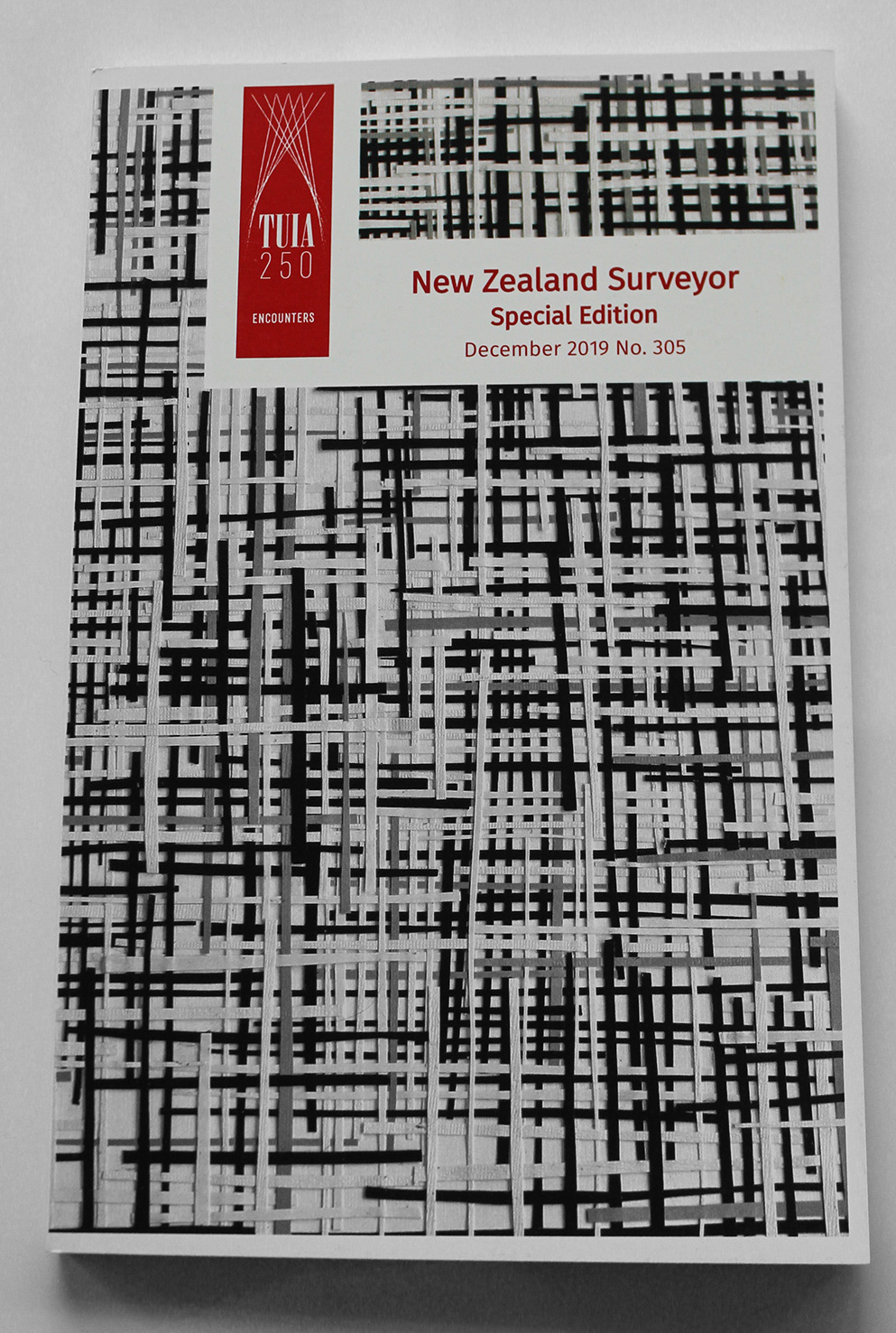 NZ Surveyor design and front cover artwork by Emmellee Rose