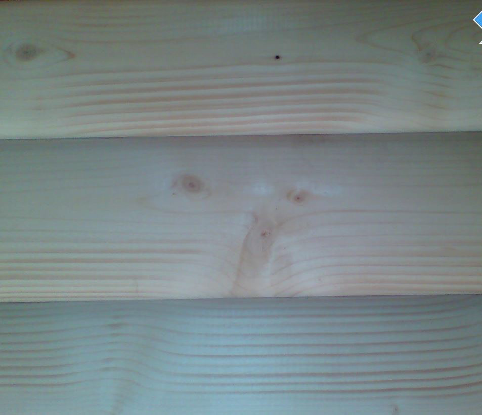 Produkt: Flott rundtømmerpanel i gran eller furu.