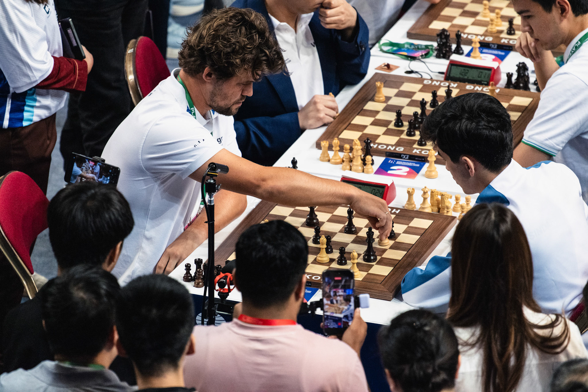 HONG KONG, China - JUNE 19: Magnus Carlsen of WR Chess and Javokhir Sindarov of Uzbekistan compete during FIDE World Team Rapid and Blitz Chess Championships 2026 at Queen Elizabeth Stadium on June 19, 2026 in Hong Kong, China, (Photo by Jack Ng/Alamy Live News)