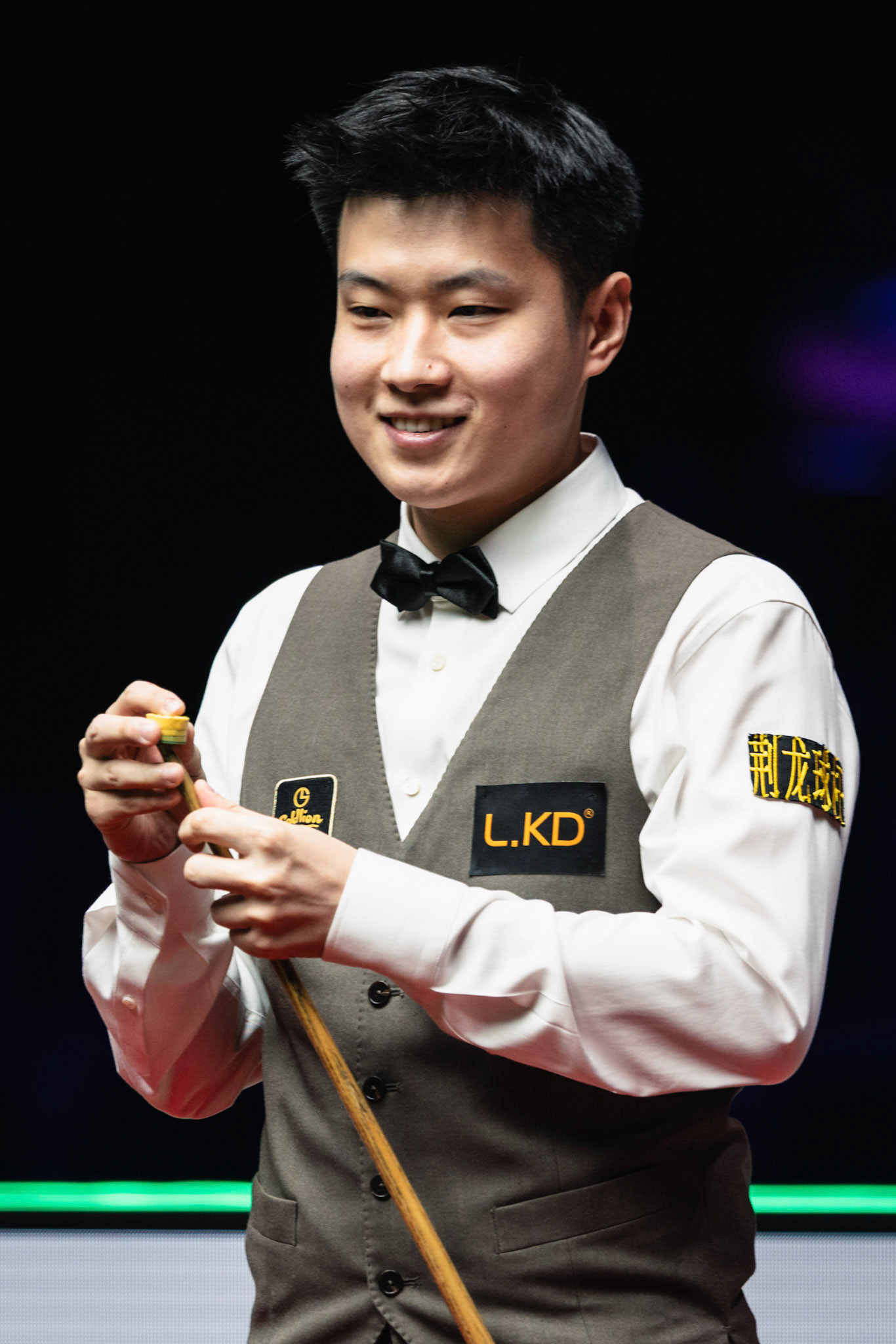 HONG KONG, China - FEBRUARY 05: Zhao Xintong of China chalks the cue during WST World Grand Prix 2026 against Mark Selby of England at Kai Tak Arena on February 5, 2026 in Hong Kong, China, (Photo by Jack Ng/Alamy Live News)