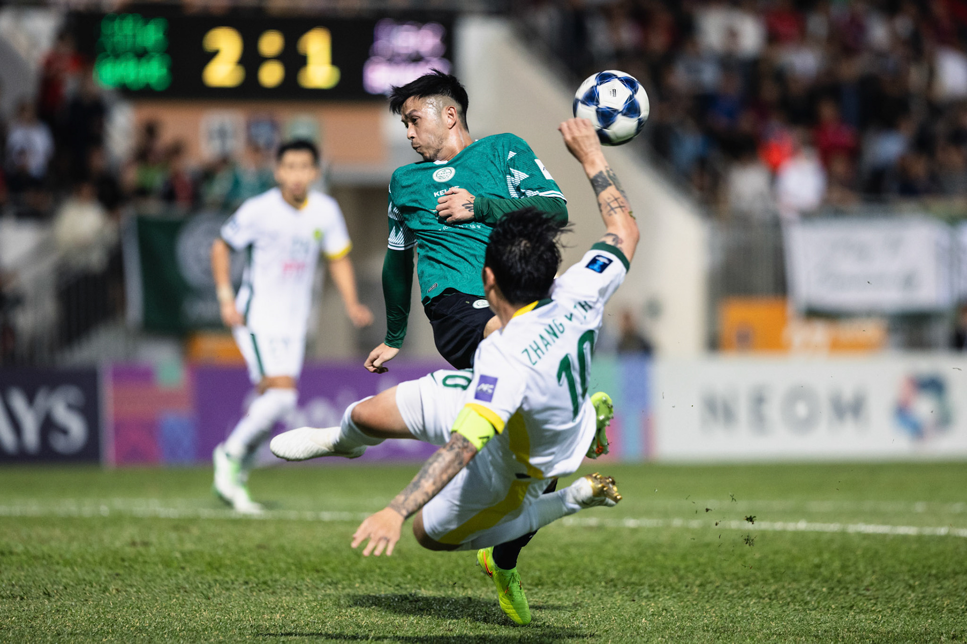 Mong Kok Stadium, HONG KONG, China - OCTOBER  23:  CHAN Siu Kwan Philip of Tai Po Football Club clears the danger from Zhang Xizhe of Beijing FC during AFC Champions League TWO - Tai Po Football Club vs Beijing FC at Mong Kok Stadium on October 23, 2025 in Hong Kong, China, (Photo by Jack Ng/Jack Ng/Alamy Live News)