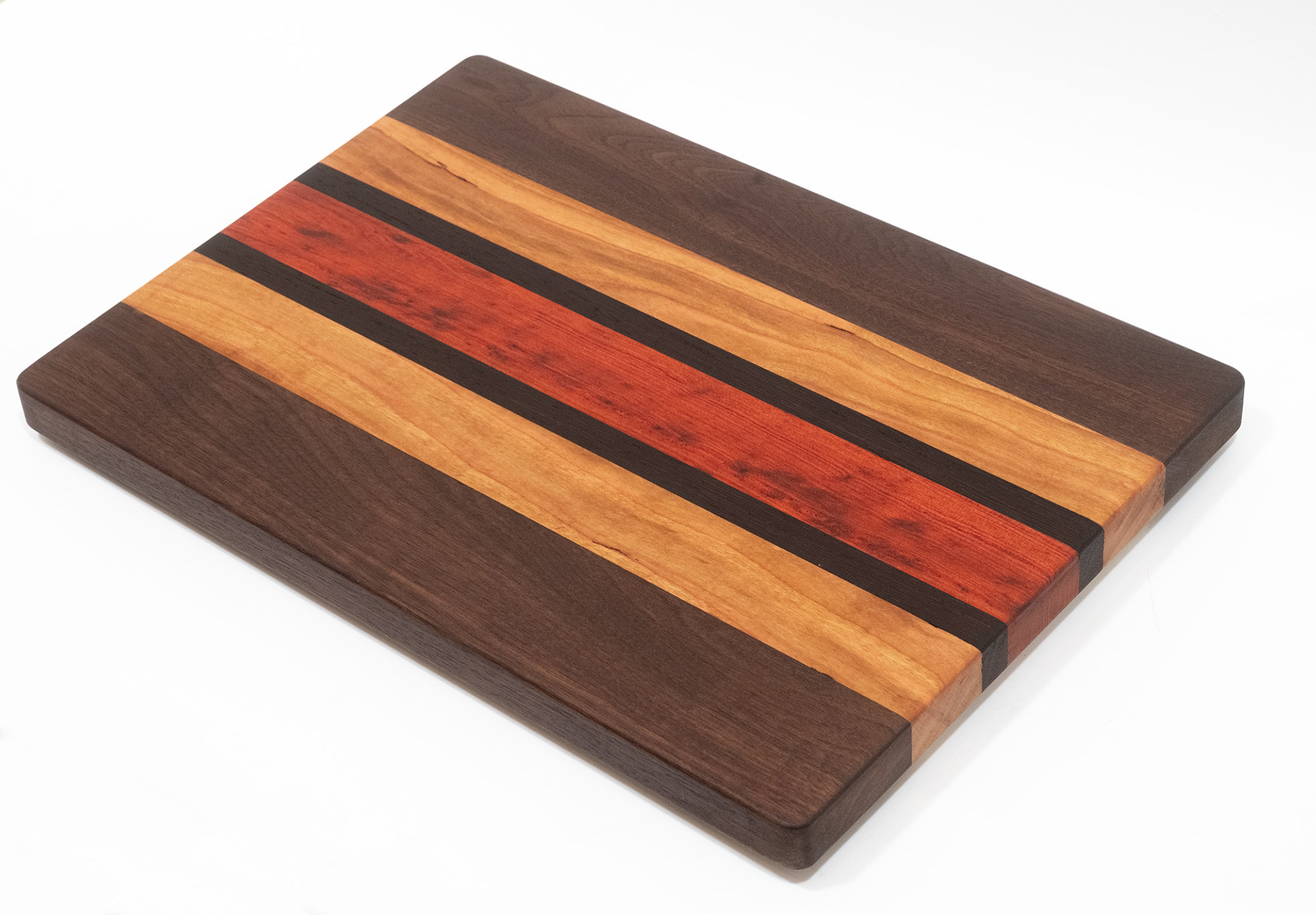 28 x 38 cm Walnut, cherry, wenge and redheart.