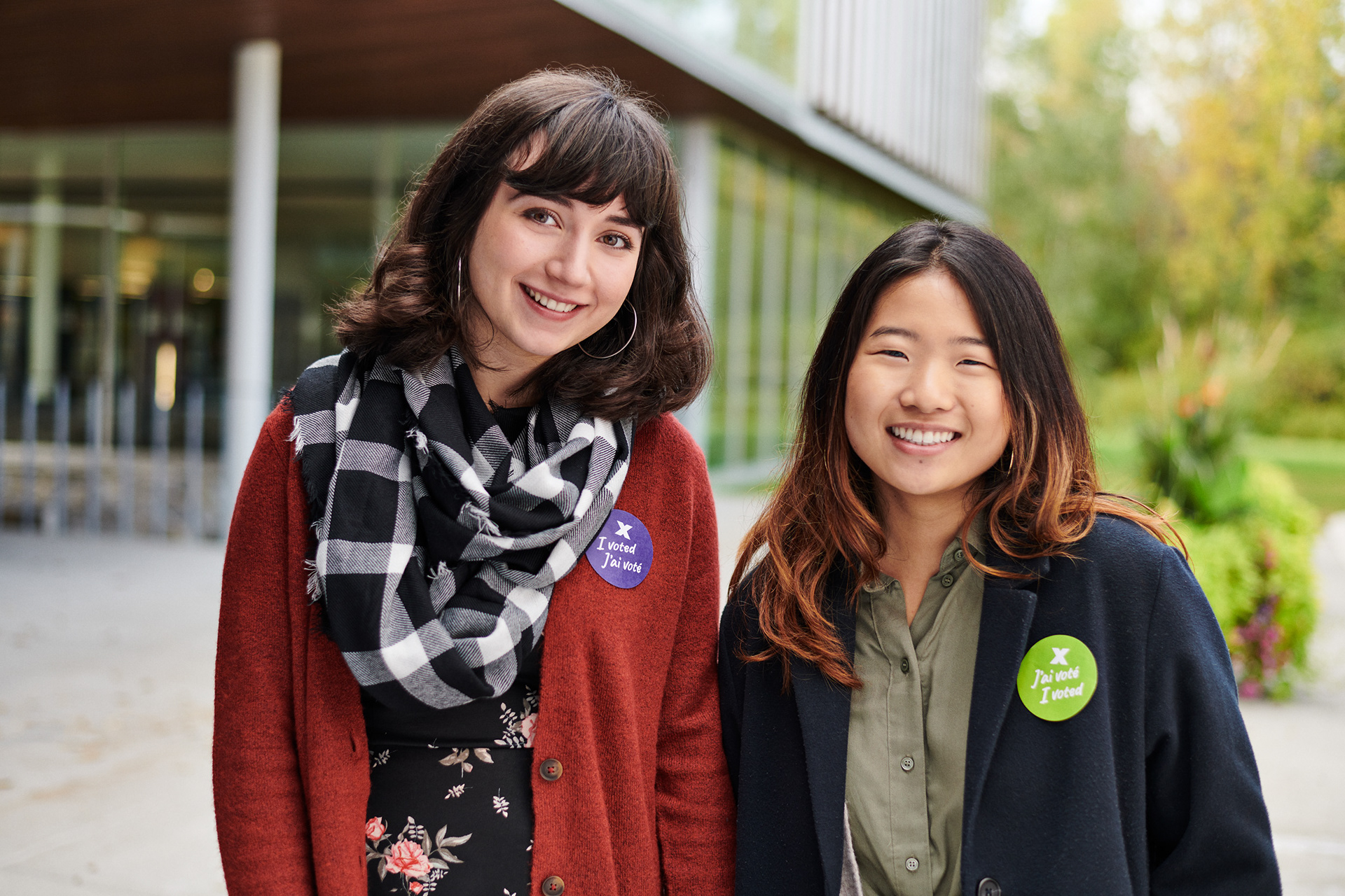 a groups portrait of 2 women one asian the other European looking