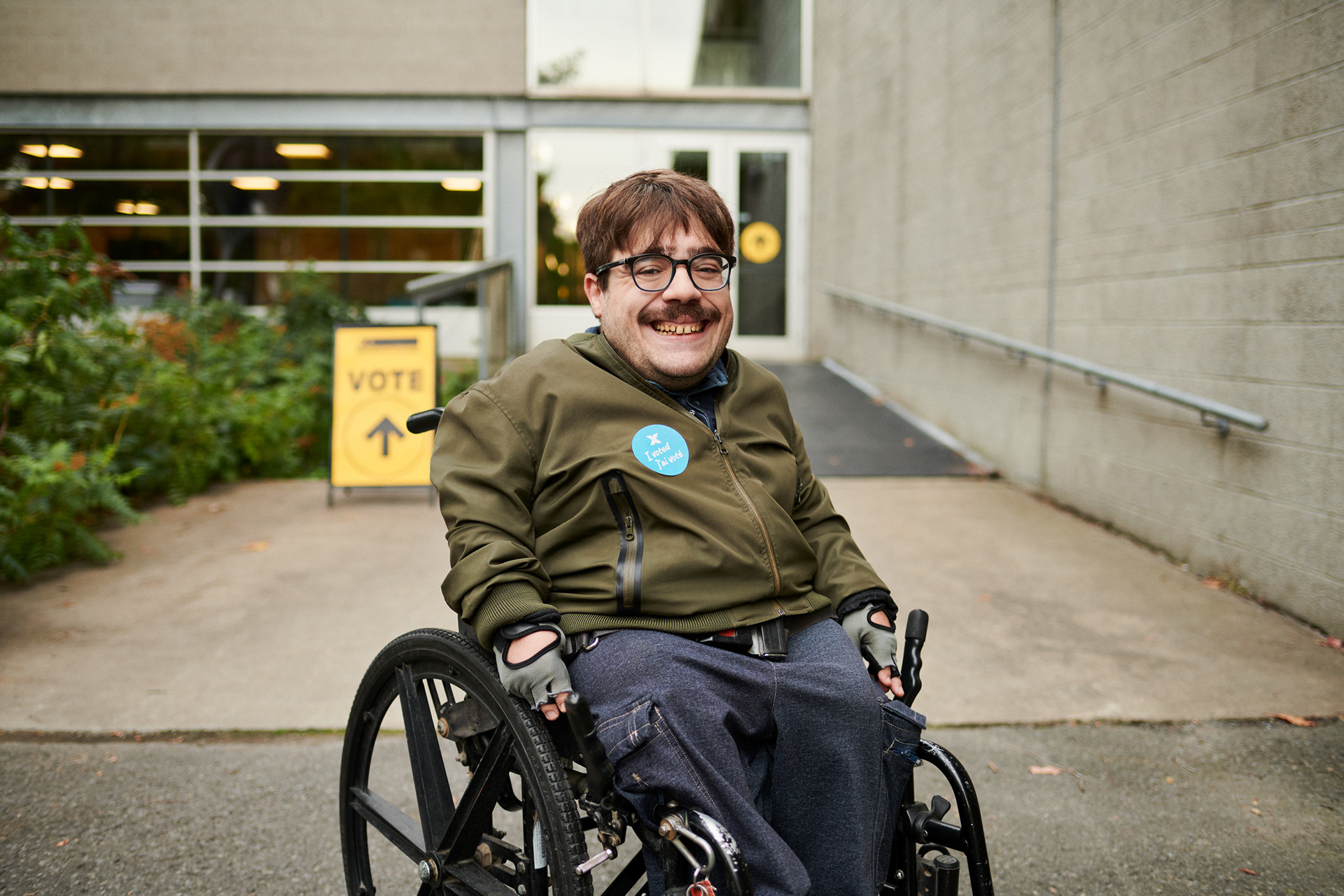 a handicap adult in a wheelchair waits while being photographed