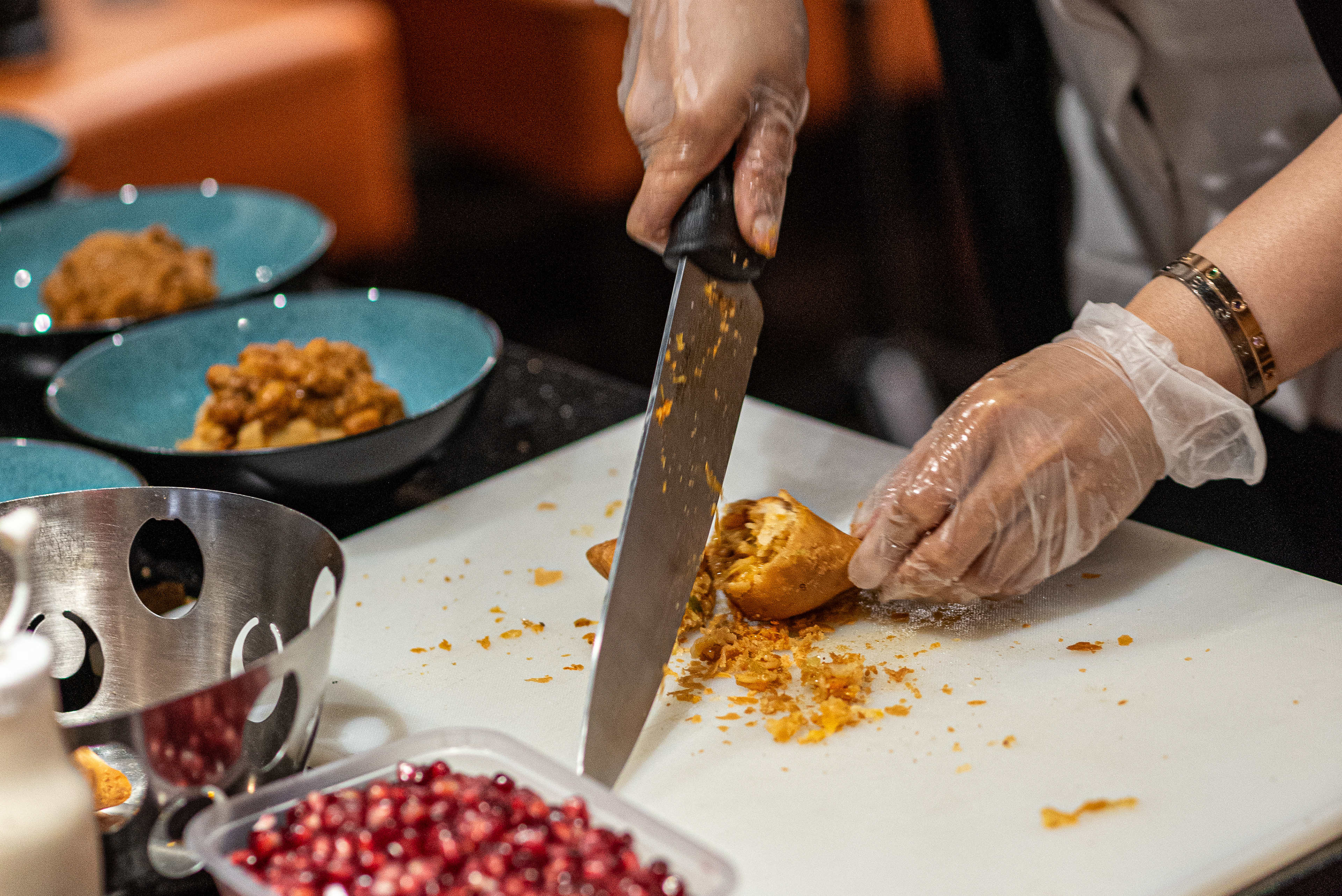 Dipna Anand Brilliant Restaurant plating up Samosa and Chana