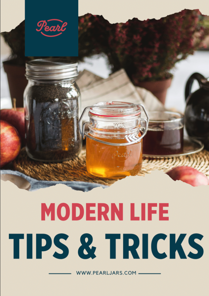 Book cover titled "Modern Life Tips & Tricks" featuring glass jars with preserved foods and drinks arranged on a tabletop.