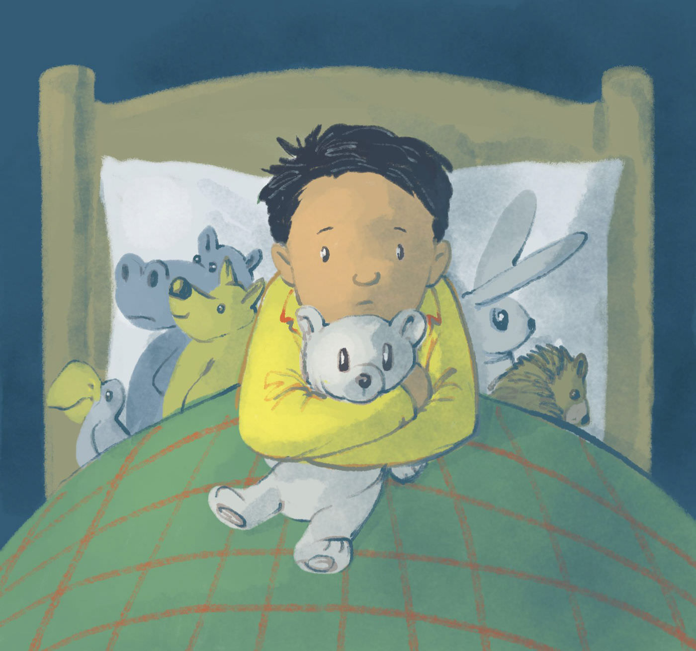 A small boy sits in bed at night, nervously clutching a teddy bear. He is surrounded by soft toys