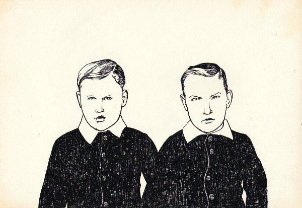 Two boys in black suits with white collars