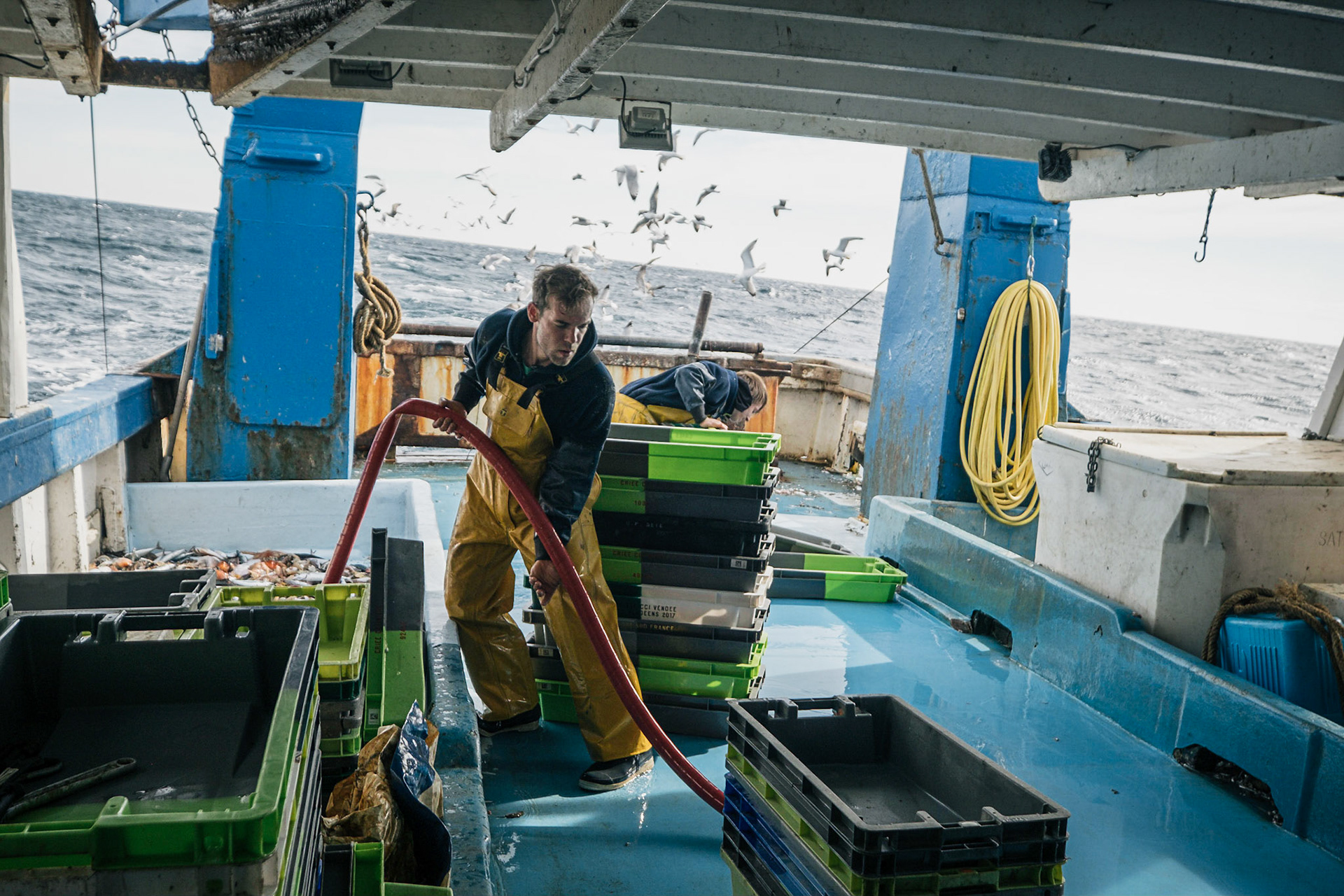France, Sete, 2021-03-18. Three fishermen working off Sete off in the golfe du lion, on a bottom trawler during a day shift, followed by the sell at the auction of Sete. Photography by Maxime Gruss / Hans Lucas.France, Sete, 2021-03-18. Trois pecheurs travaillant au large de Sete dans le golfe du lion, sur un chalutier de fond pendant une journee de travail, suivie de la vente a la criee de Sete. Photographie de Maxime Gruss / Hans Lucas.