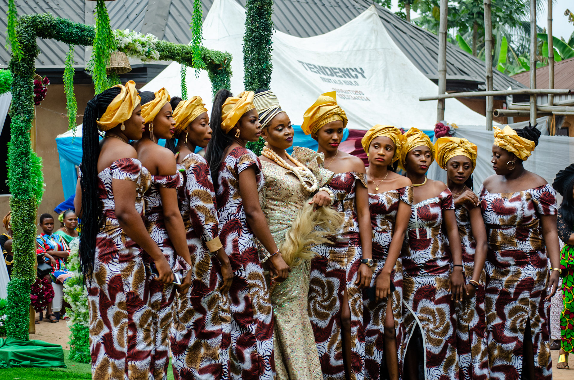 The Asoebi. A slang term for bridesmaids. The actual meaning is a uniform dress that is traditionally worn in Nigeria and other African cultures as an indicator of cooperation and solidarity during ceremonies and festivals