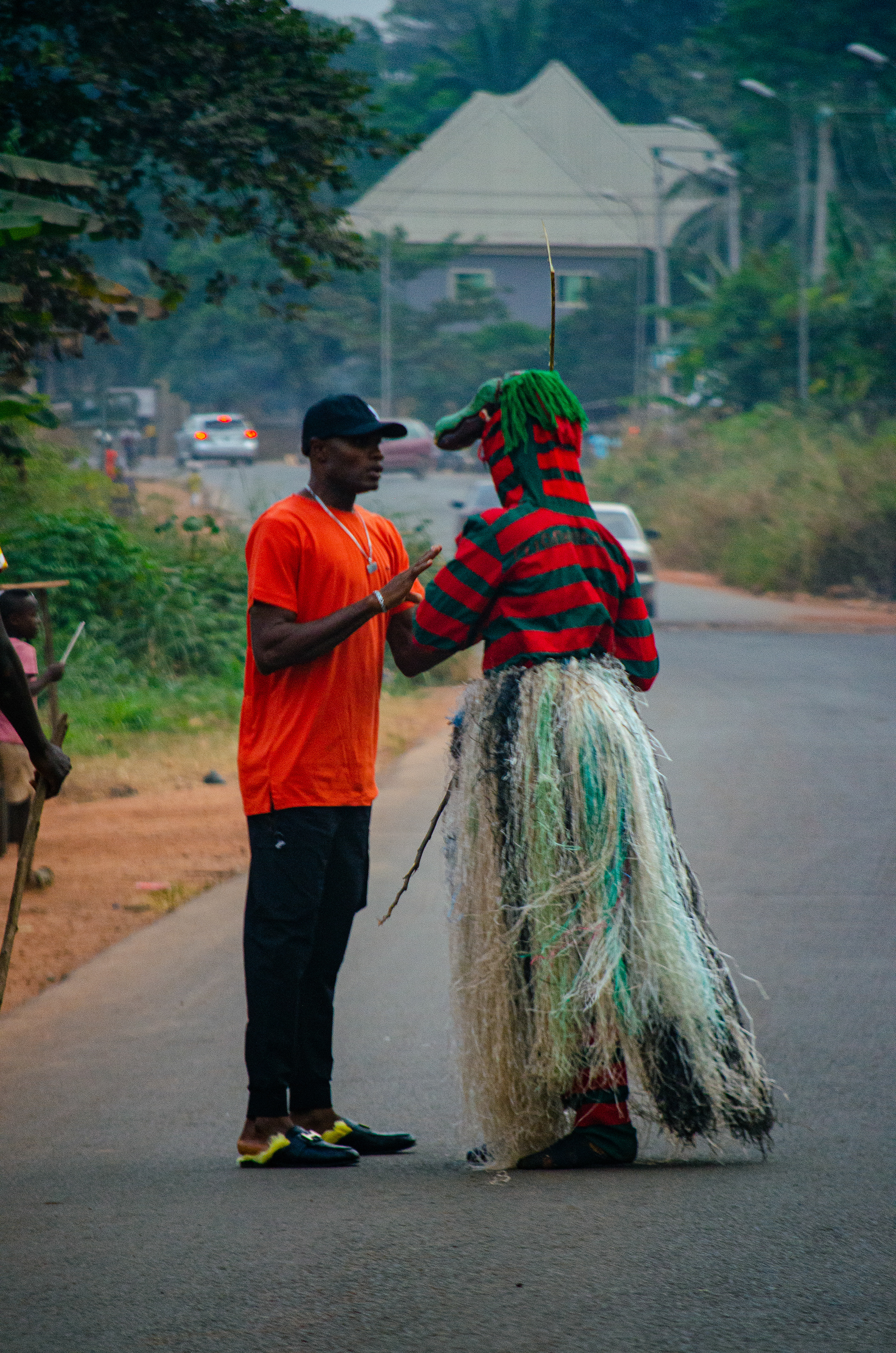 This is the biggest example of aggression that our native masquerades display. Literally one second after I took this picture the masquerade started whipping the boy with a cane