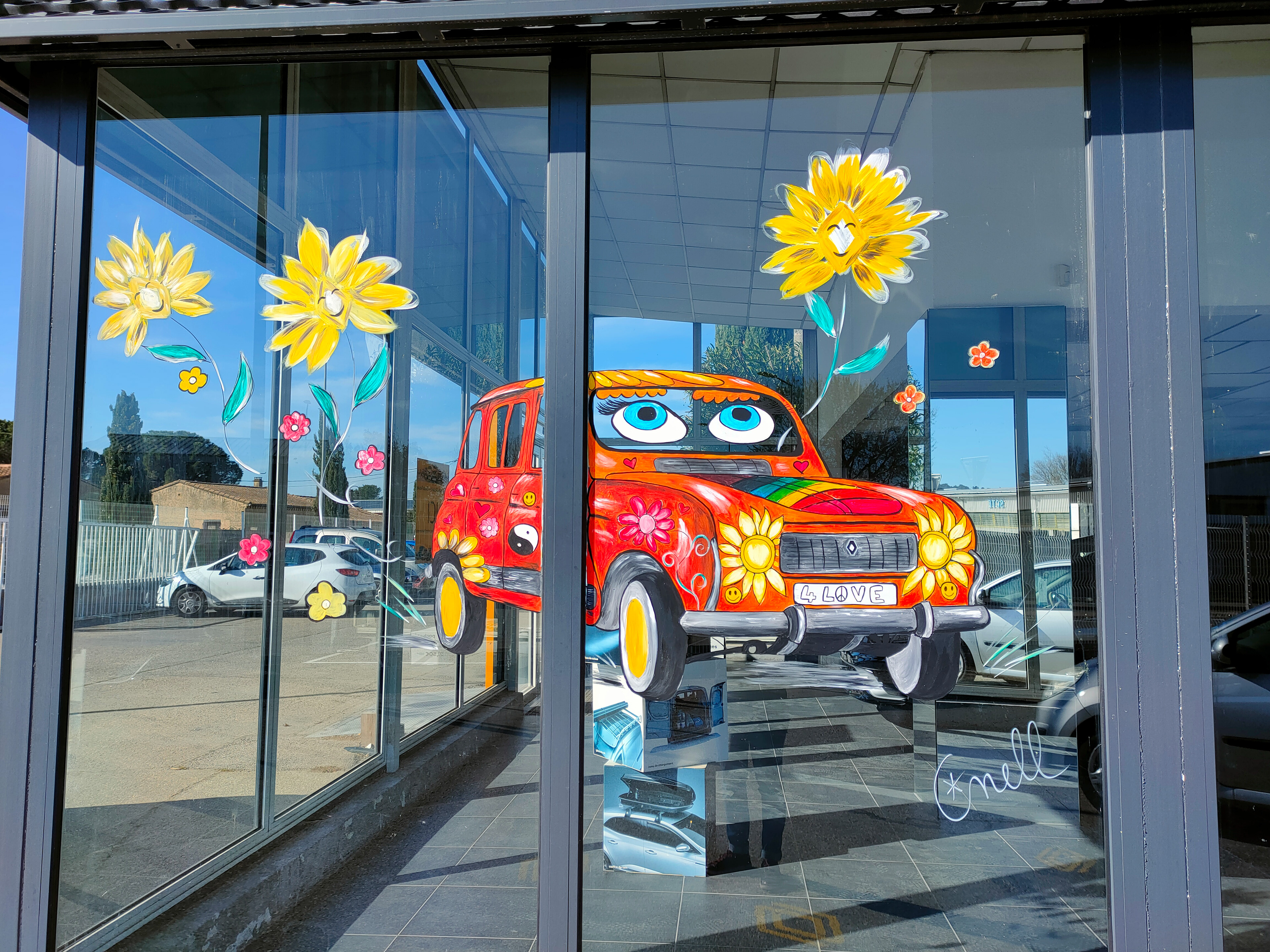 Peinture sur vitrine pour un garage Renault