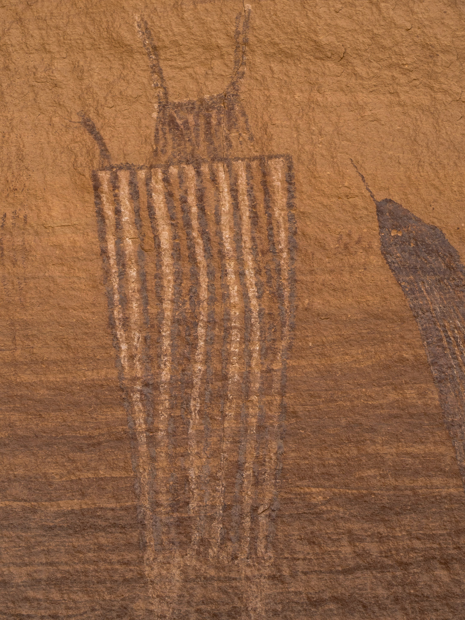 Figure with stripes, common in Fremont Culture pictographs