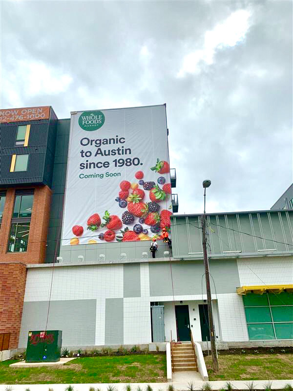 Outdoor banner designed for the opening of the East Austin store