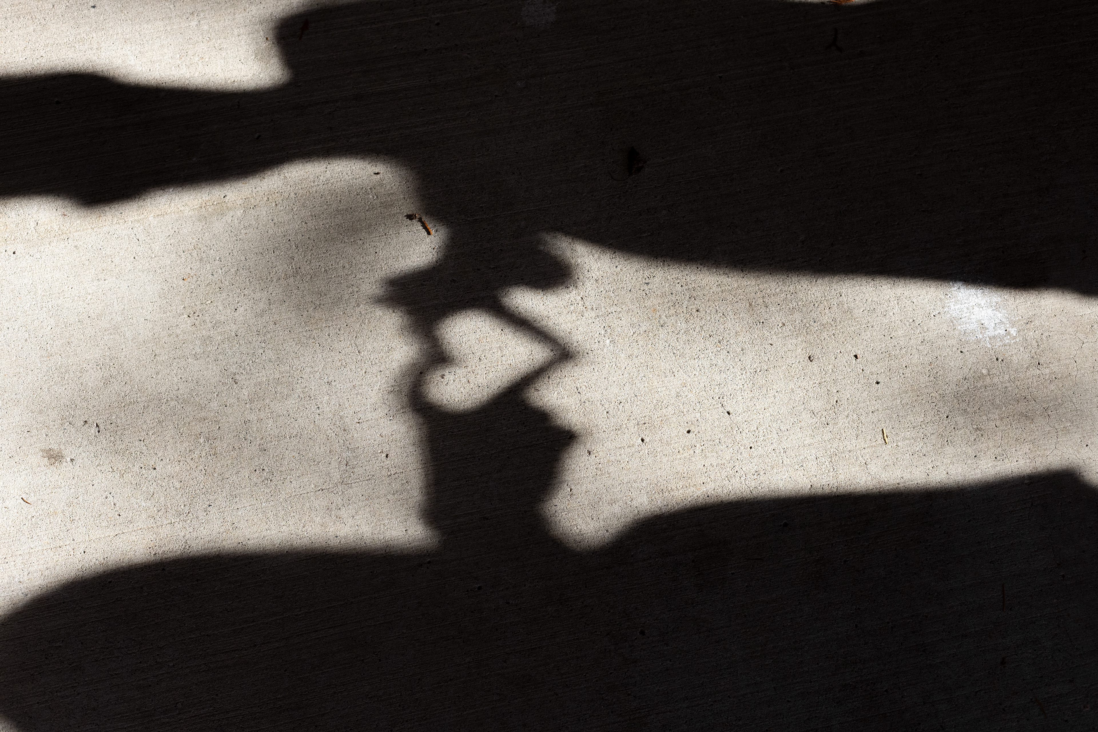 A heart shadow made with two different people 
