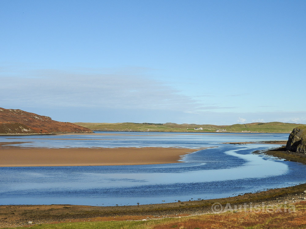 Kyle of Durness, North West Scotland, sea water with sandbanks and houses on far shore