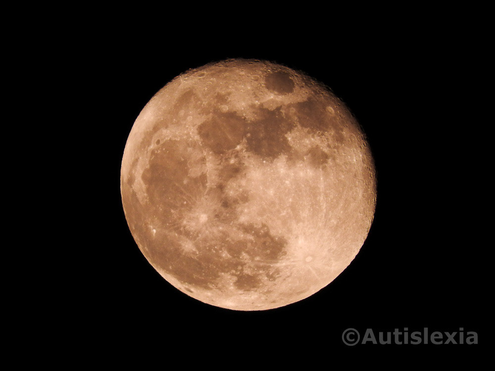 The moon looking red/brown, almost full