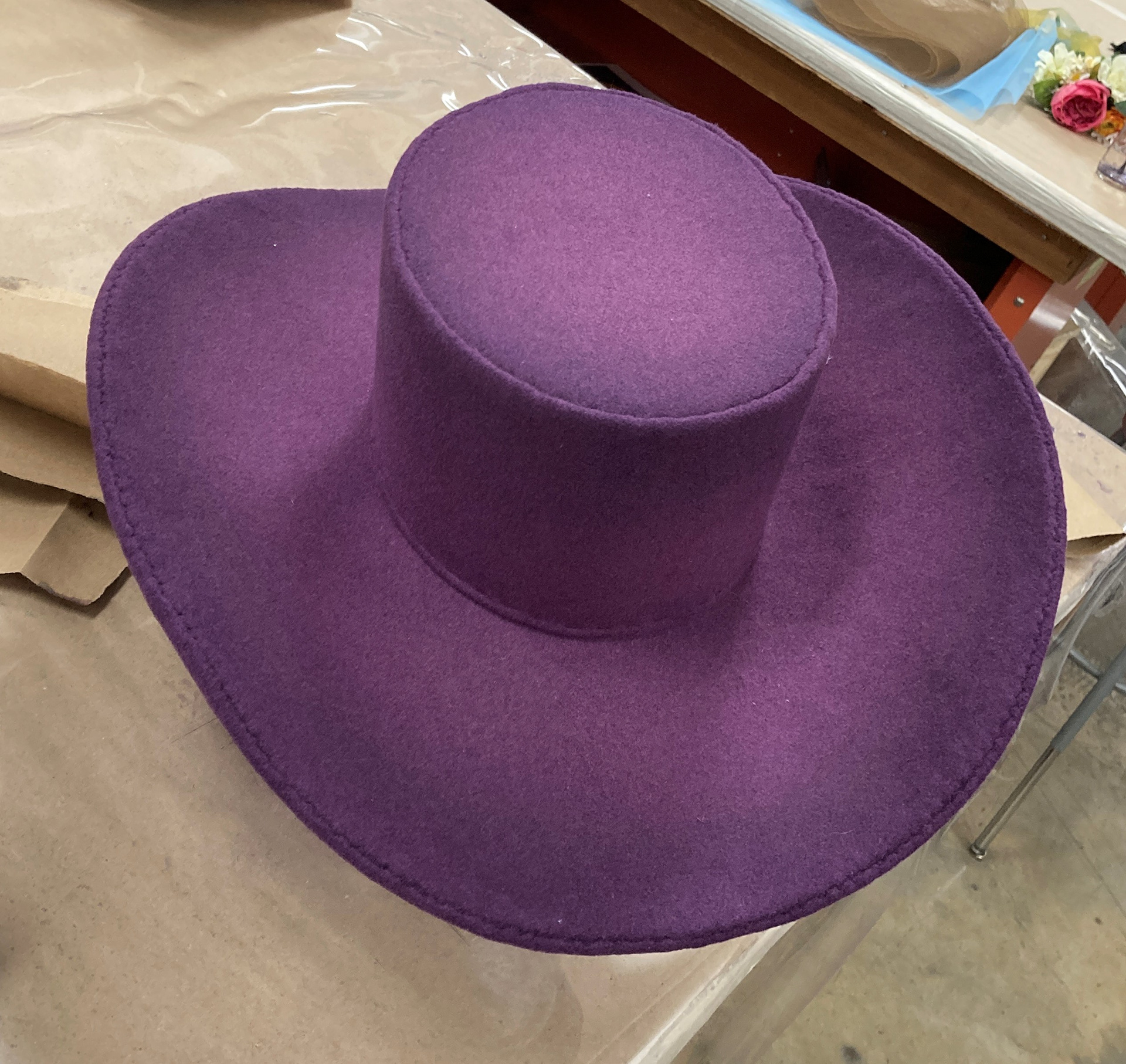 Spraying darker tone around tip and brim.