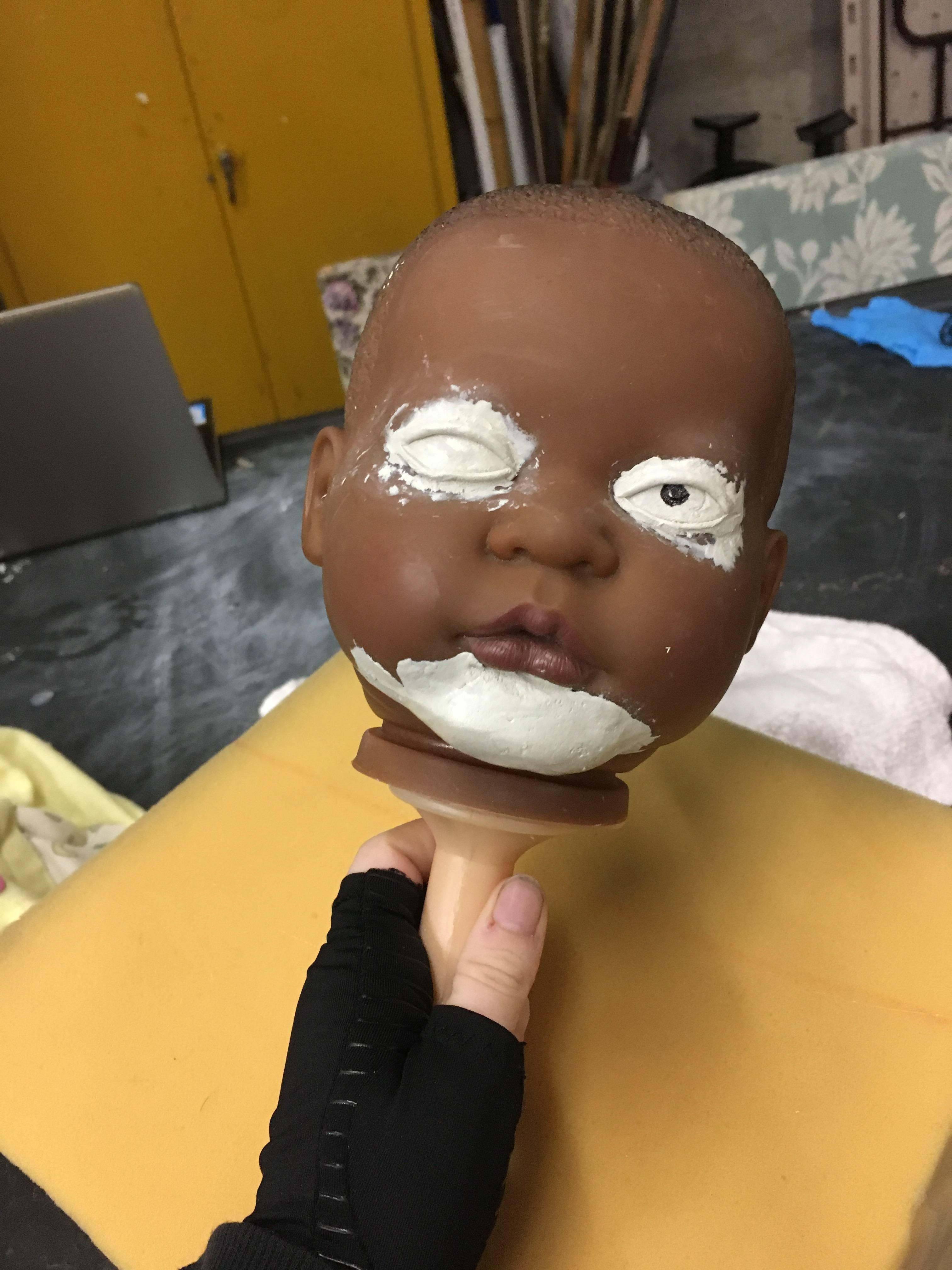 Re-Sculpting face of pre existing baby doll toy.