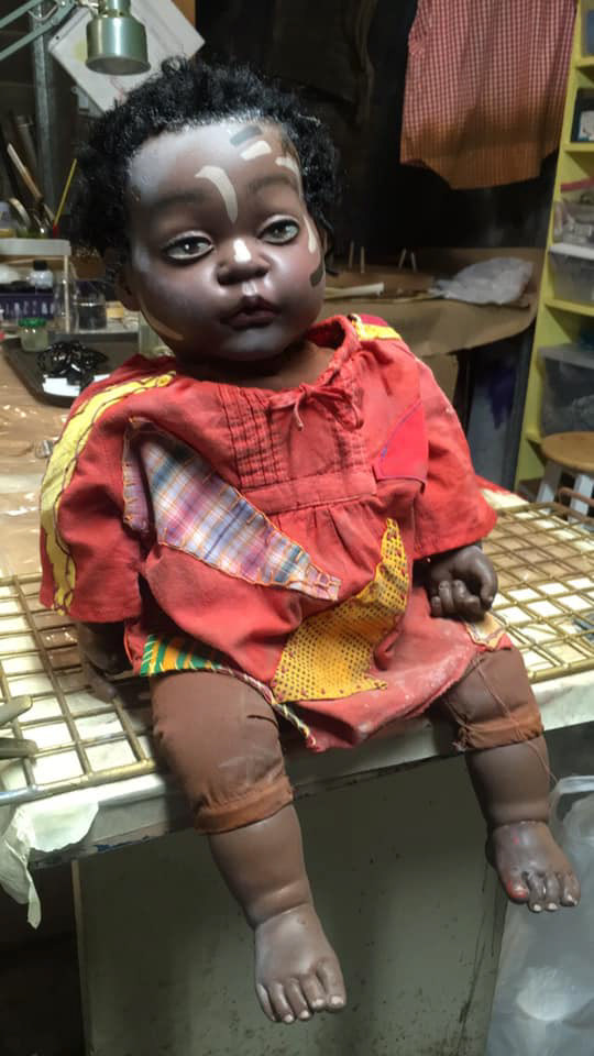Adding final details and distressing clothing.