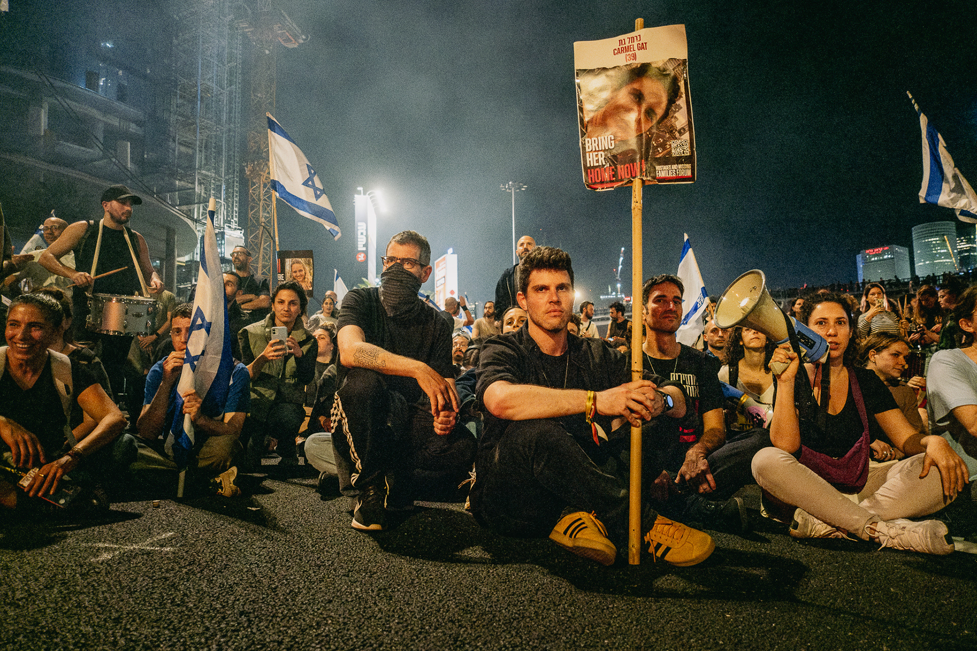 Gil Dickman, cousin of hostage Carmel Gat, blocking Ayalon highway with protestors. Tel Aviv - 30 March 2024