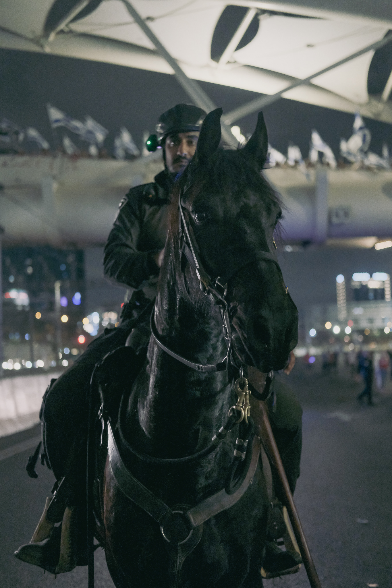 Horse mounted policeman evacuating protestors on Ayalon highway. Tel Aviv - 6 March 2023