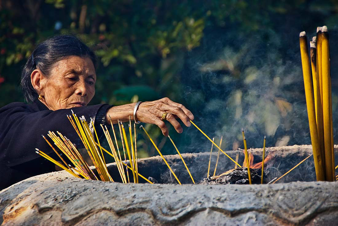 Woman outside the Po Lin Buddhist Monastery on Lantau Island, Hong Kong.