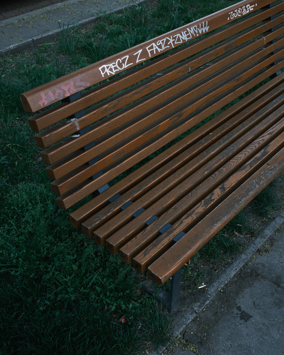"Down with fascism"; bench located at Miła 18 (the Anielewicz Bunker)