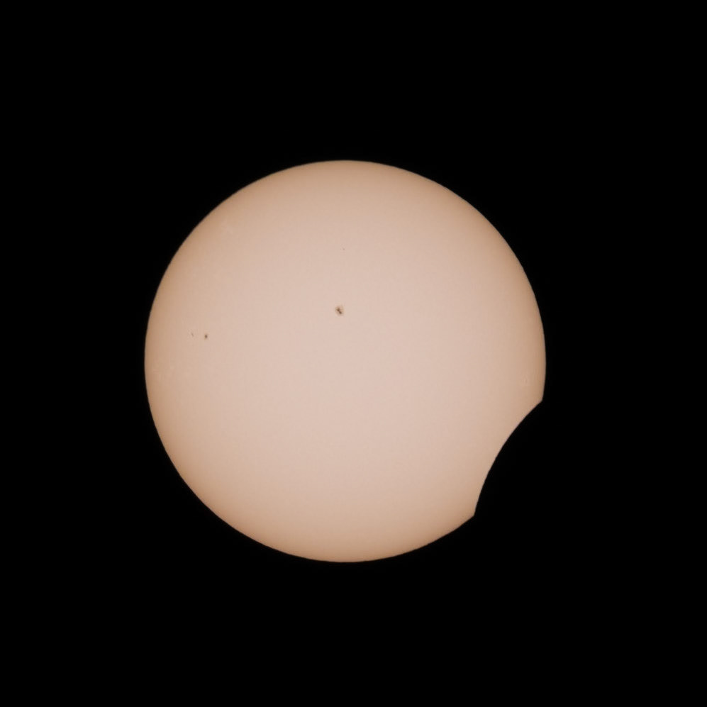 Moon in First Contact, Sunspots Visible